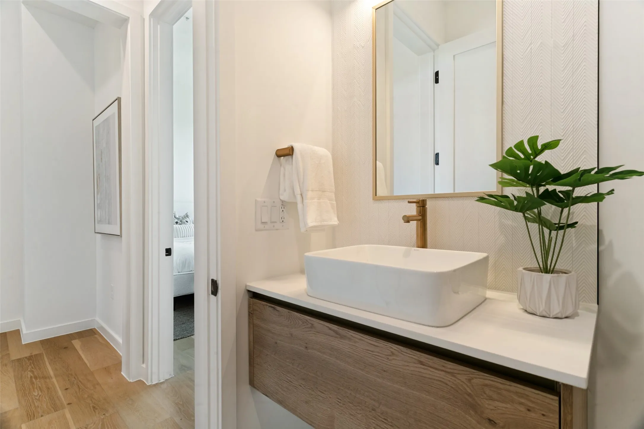 Guest bathroom with under floating cabinet floor lighting.