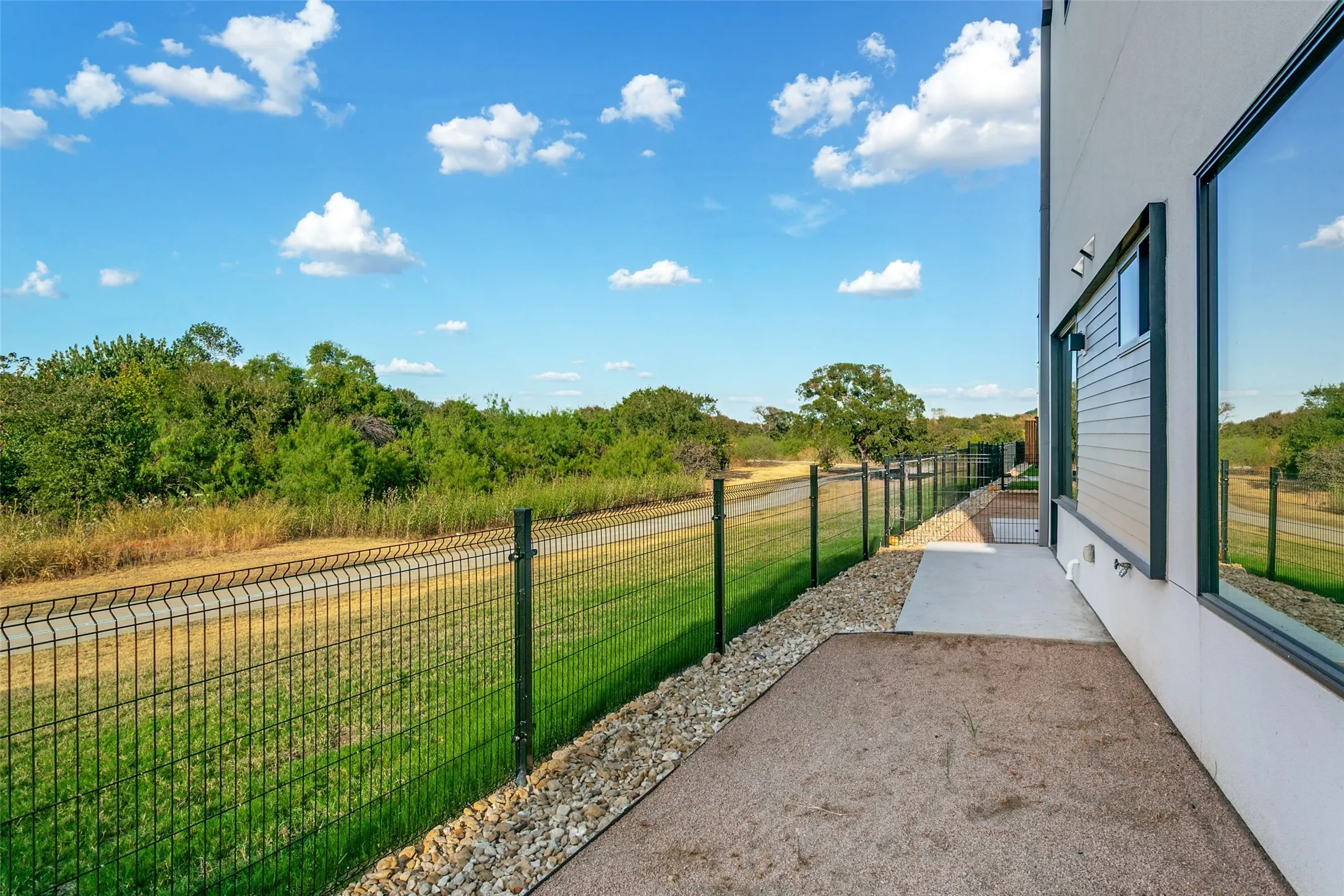 Outdoor gated courtyard with water, gas, and electric access.