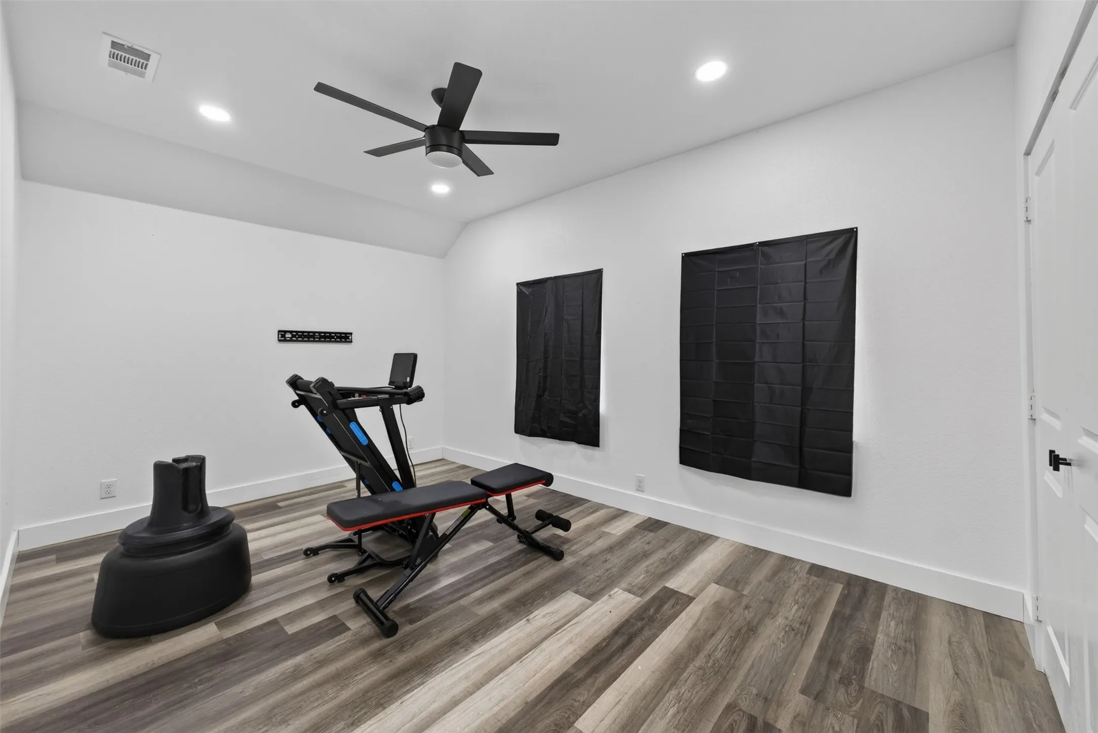 Bedroom with ceiling fan.
