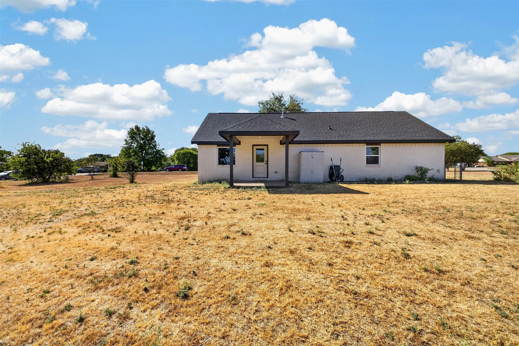 Look of the back of the house.  This yard space is just ready for you to come and create your own oasis.