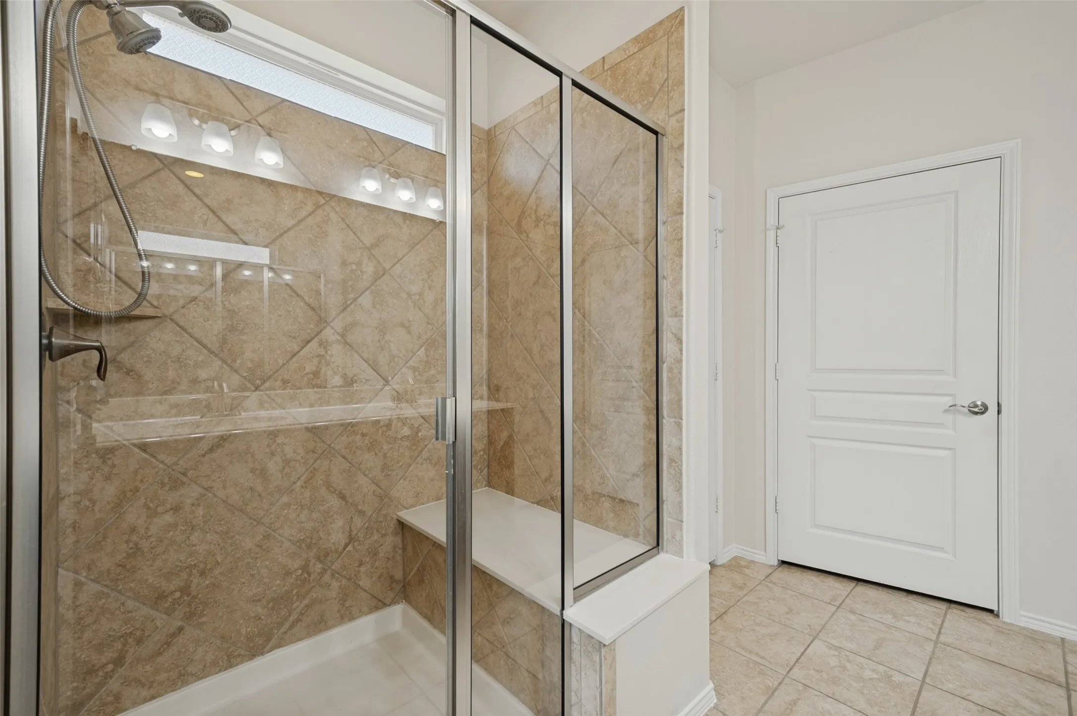 Primary Bathroom with large shower and bench.