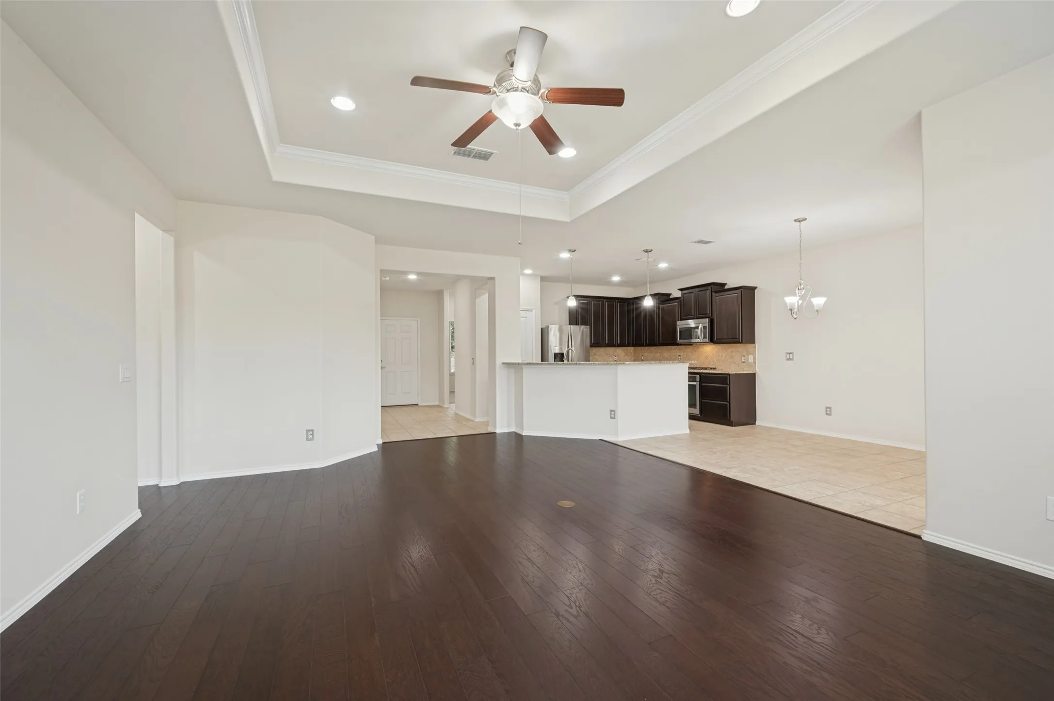 Living Room facing Dining Area and Kitchen