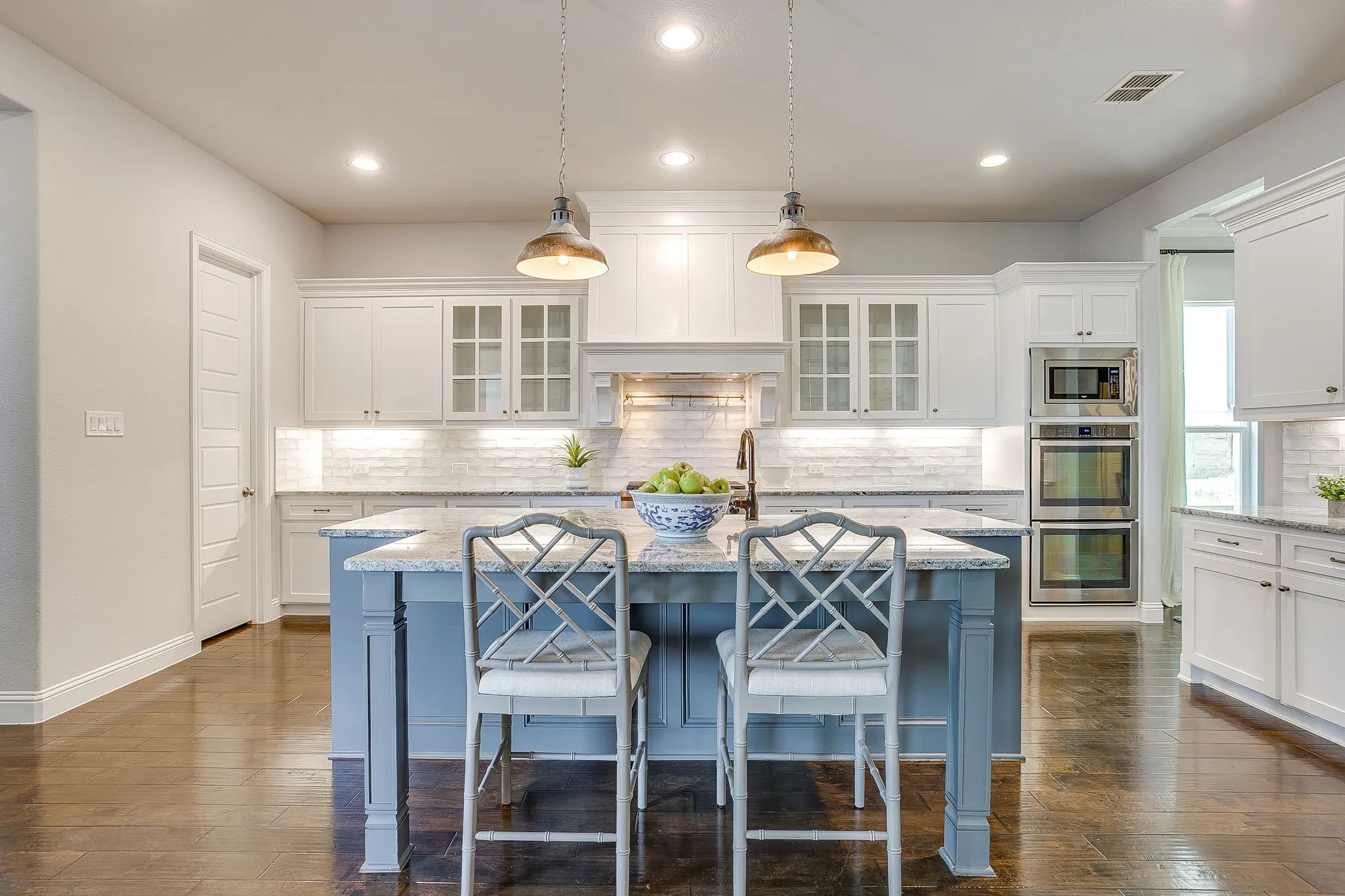 Chef's kitchen with double ovens and gas cooktop
