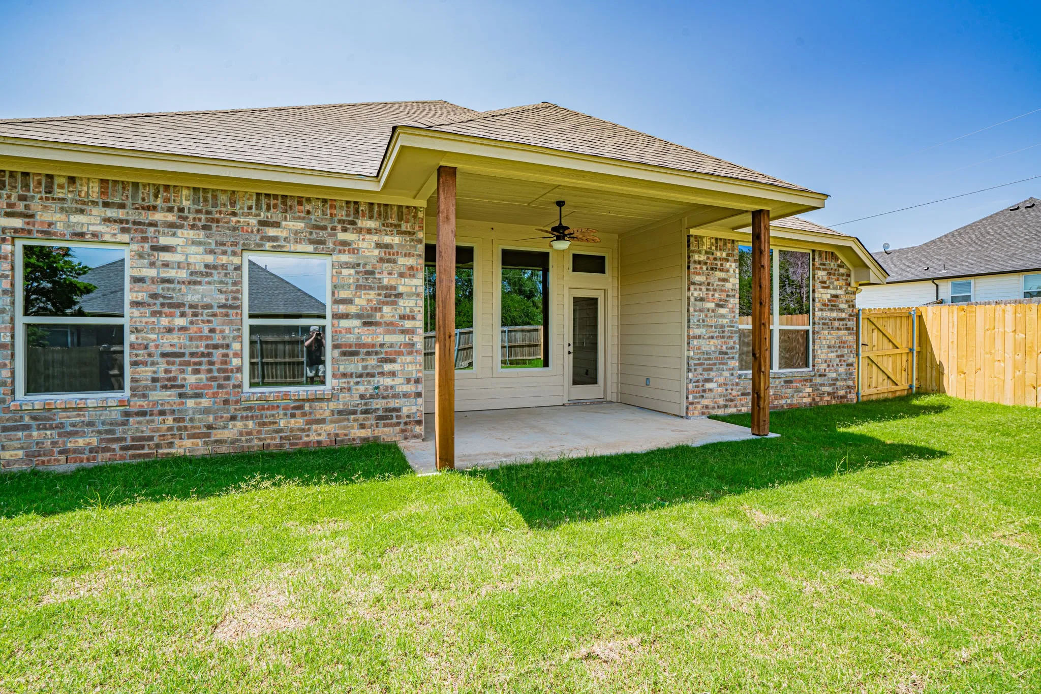 Covered back porch in large yard
