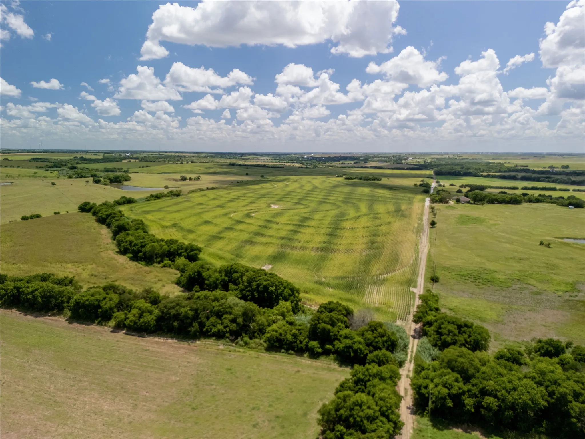 Aerial view of sparsely populated area featuring agricultural land
