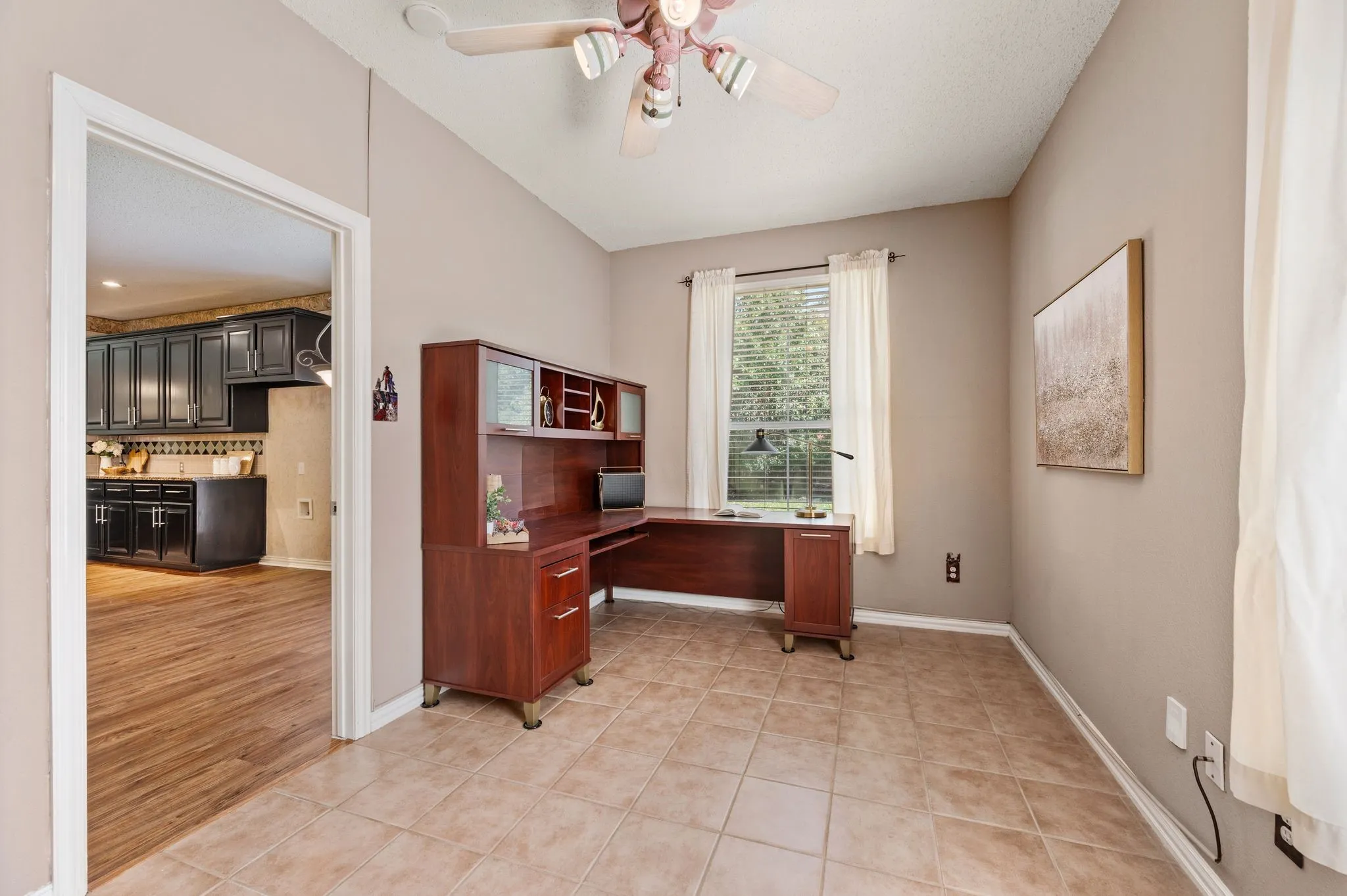 Tile flooring with light-toned walls and a window with blinds