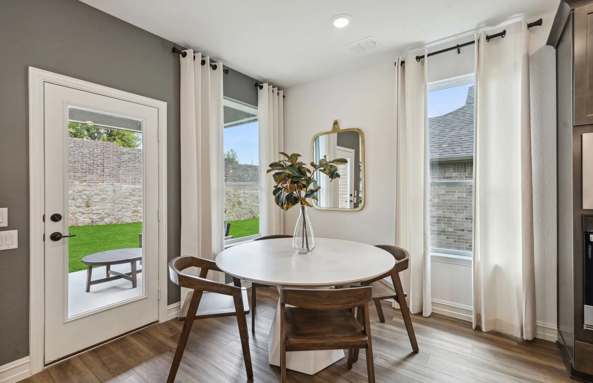 *Model Representation - Dining area off kitchen with large windows