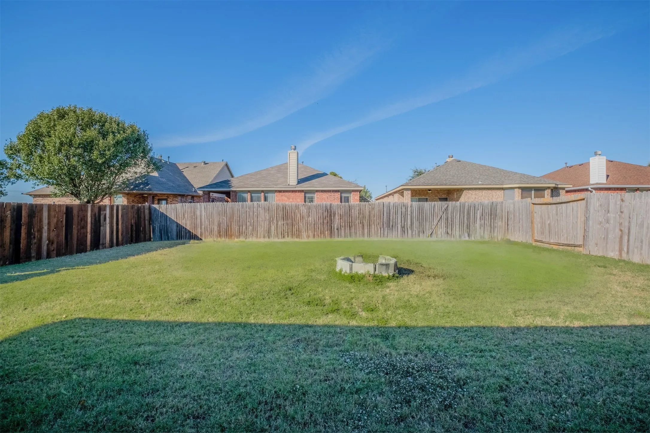 View of fenced backyard