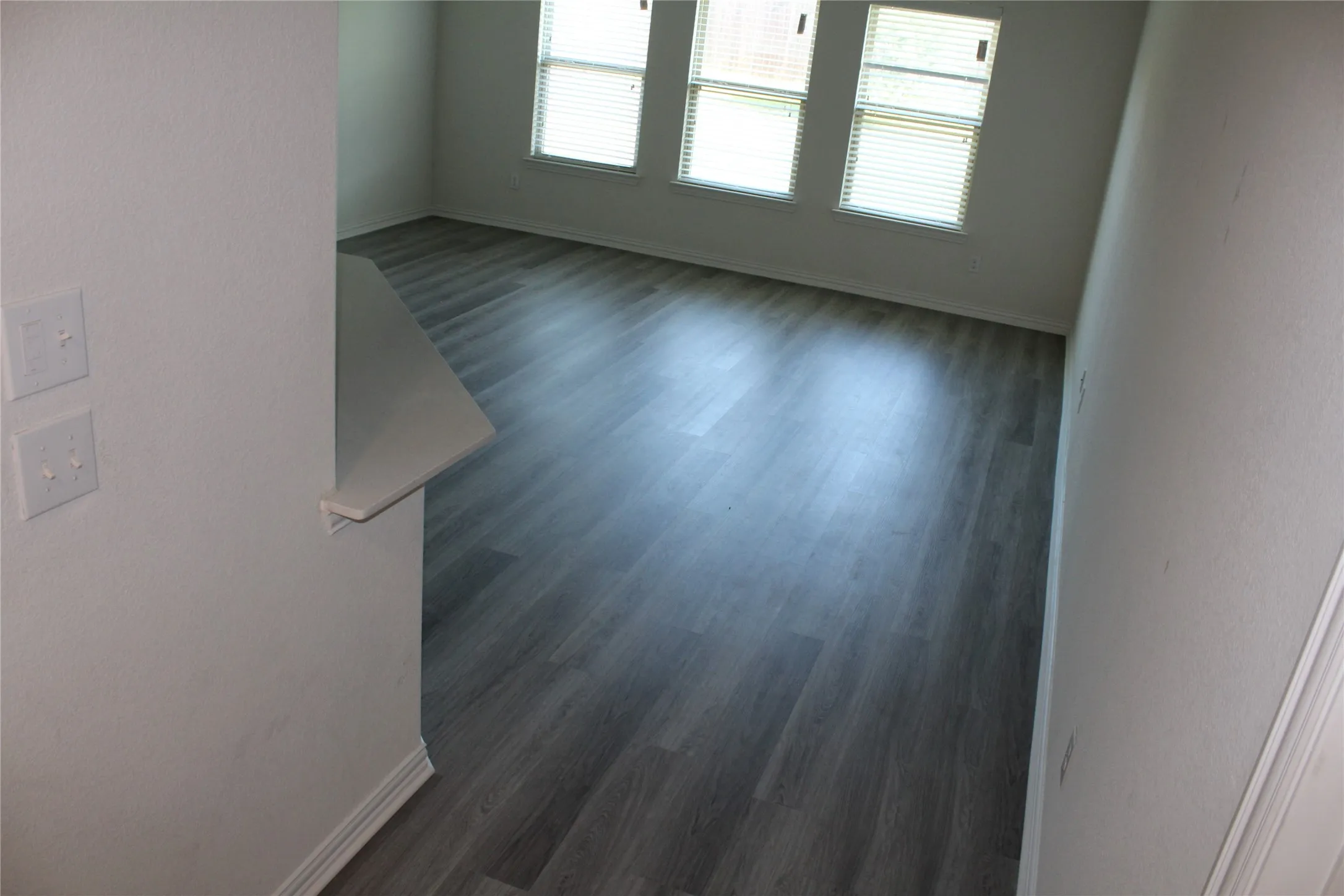 Wood-finish plank flooring throughout
