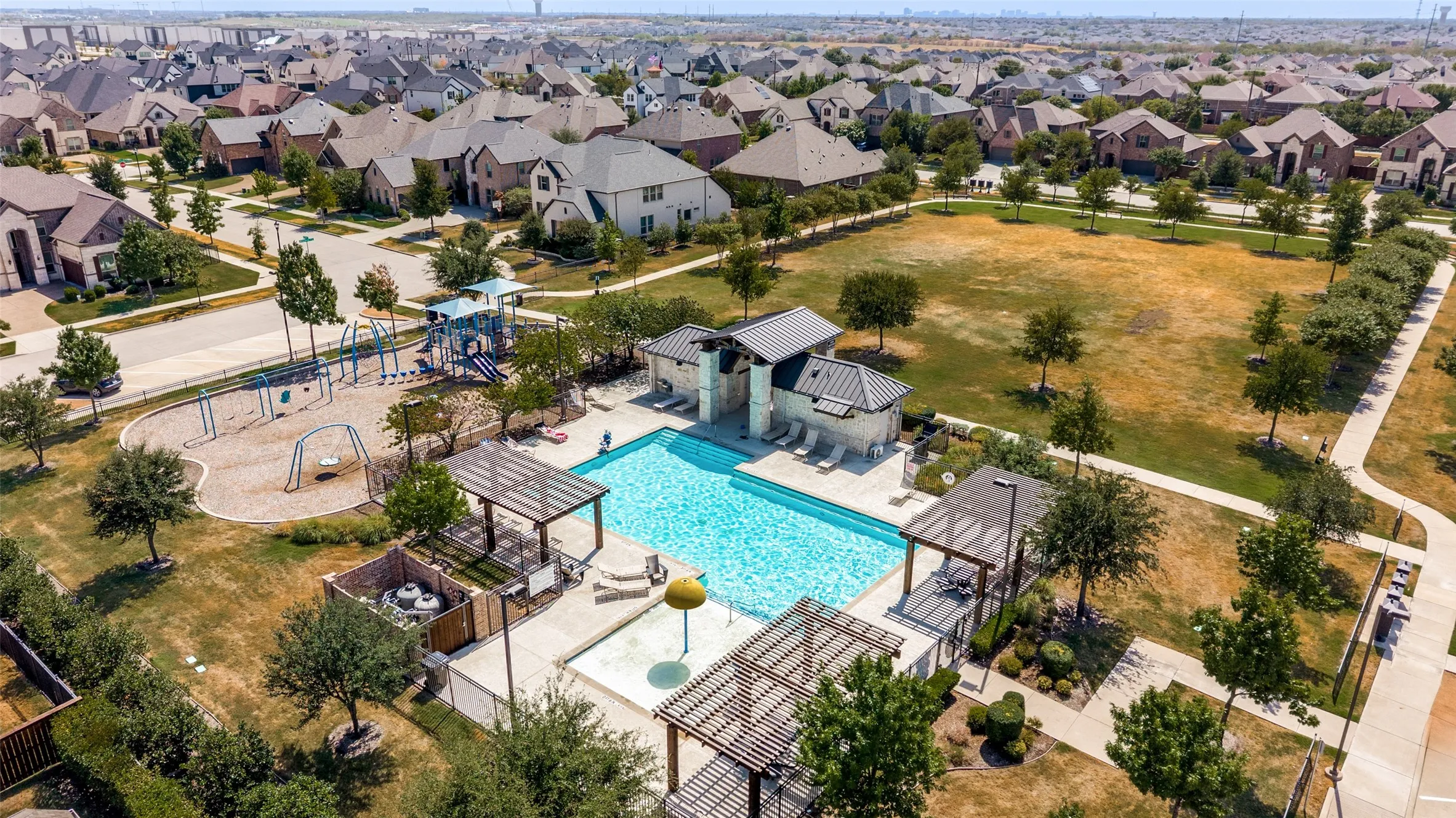 Swimming pool with integrated spa and lounge areas