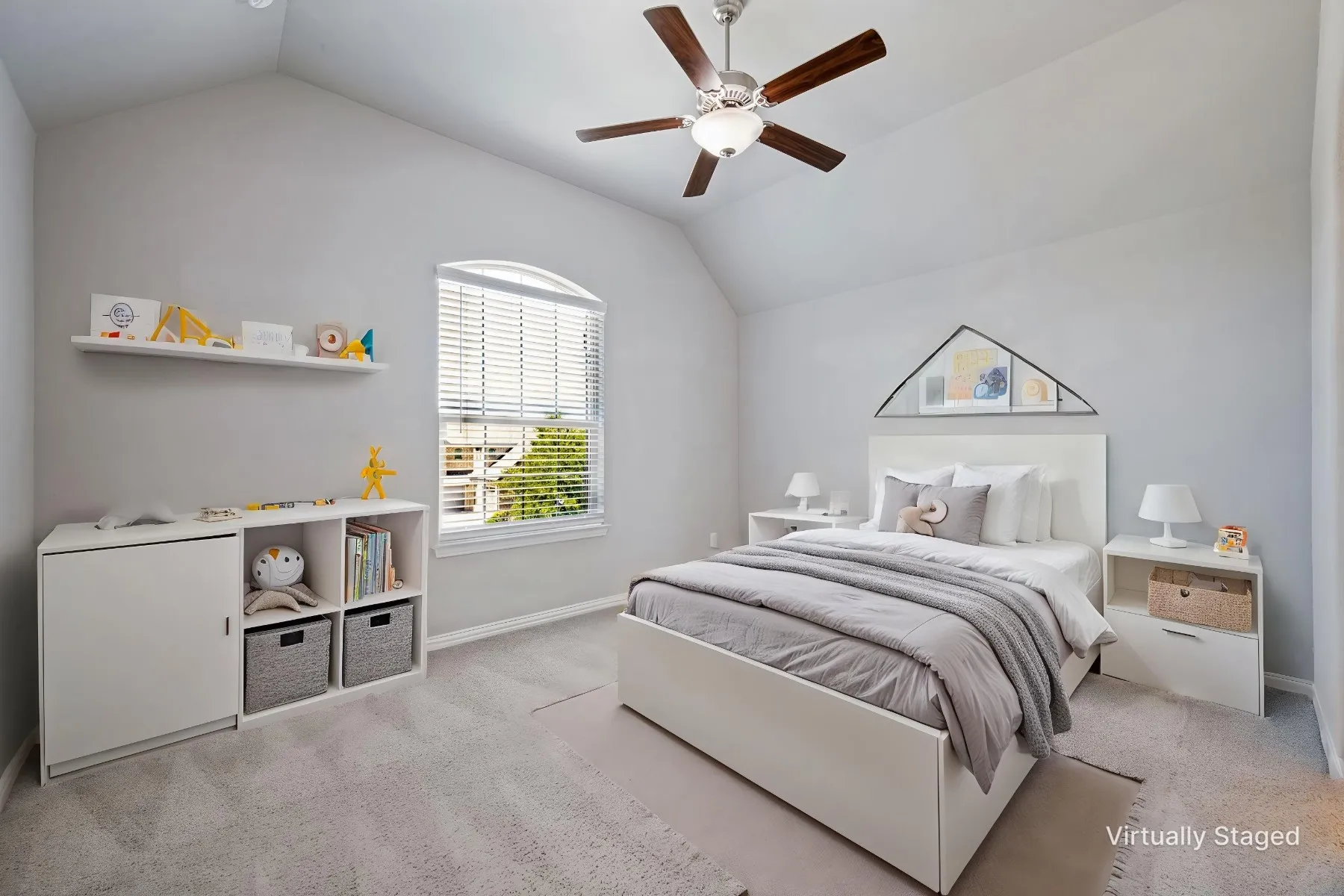 Vaulted ceiling with a ceiling fan, arched window with blinds, and light-colored carpeting