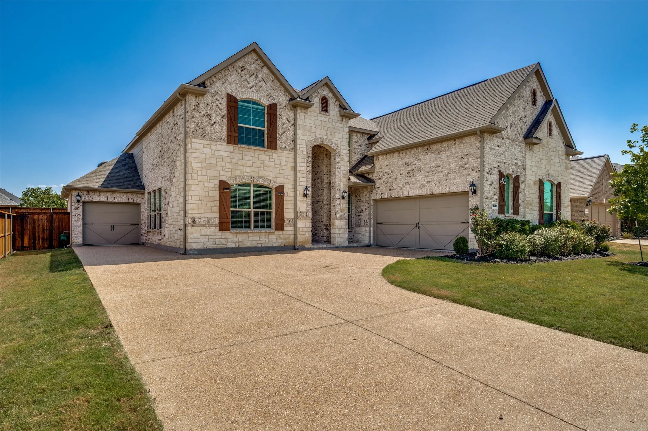 Stone and brick exterior with contrasting wood shutters