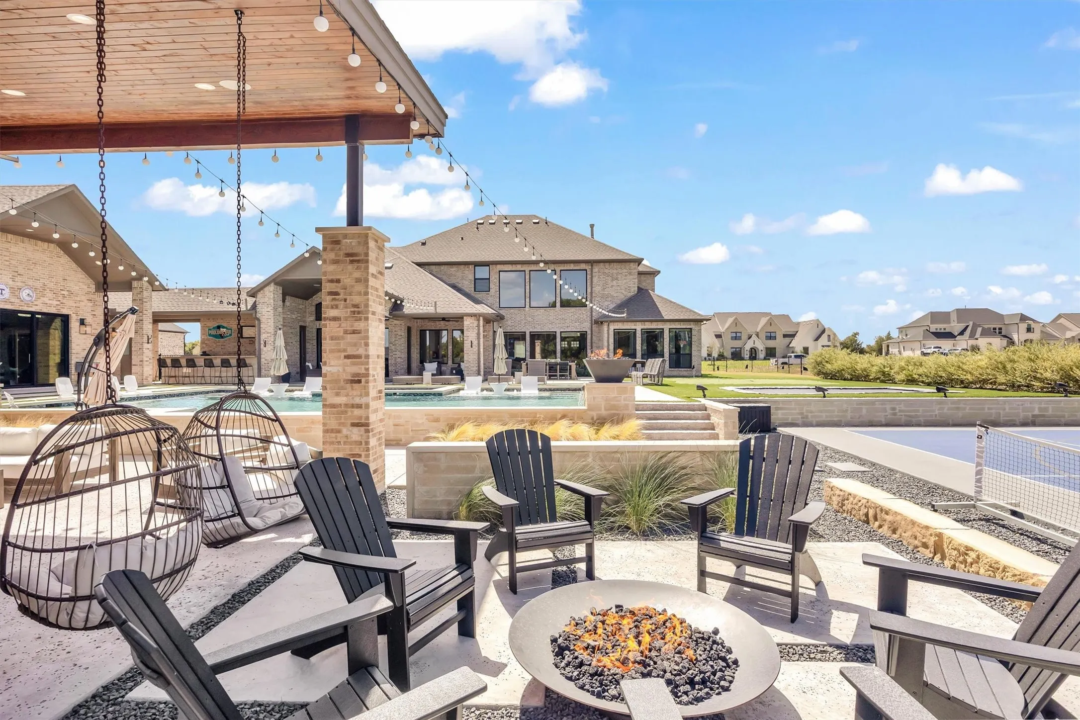 Natural gas firepit located adjacent to the sports lounge