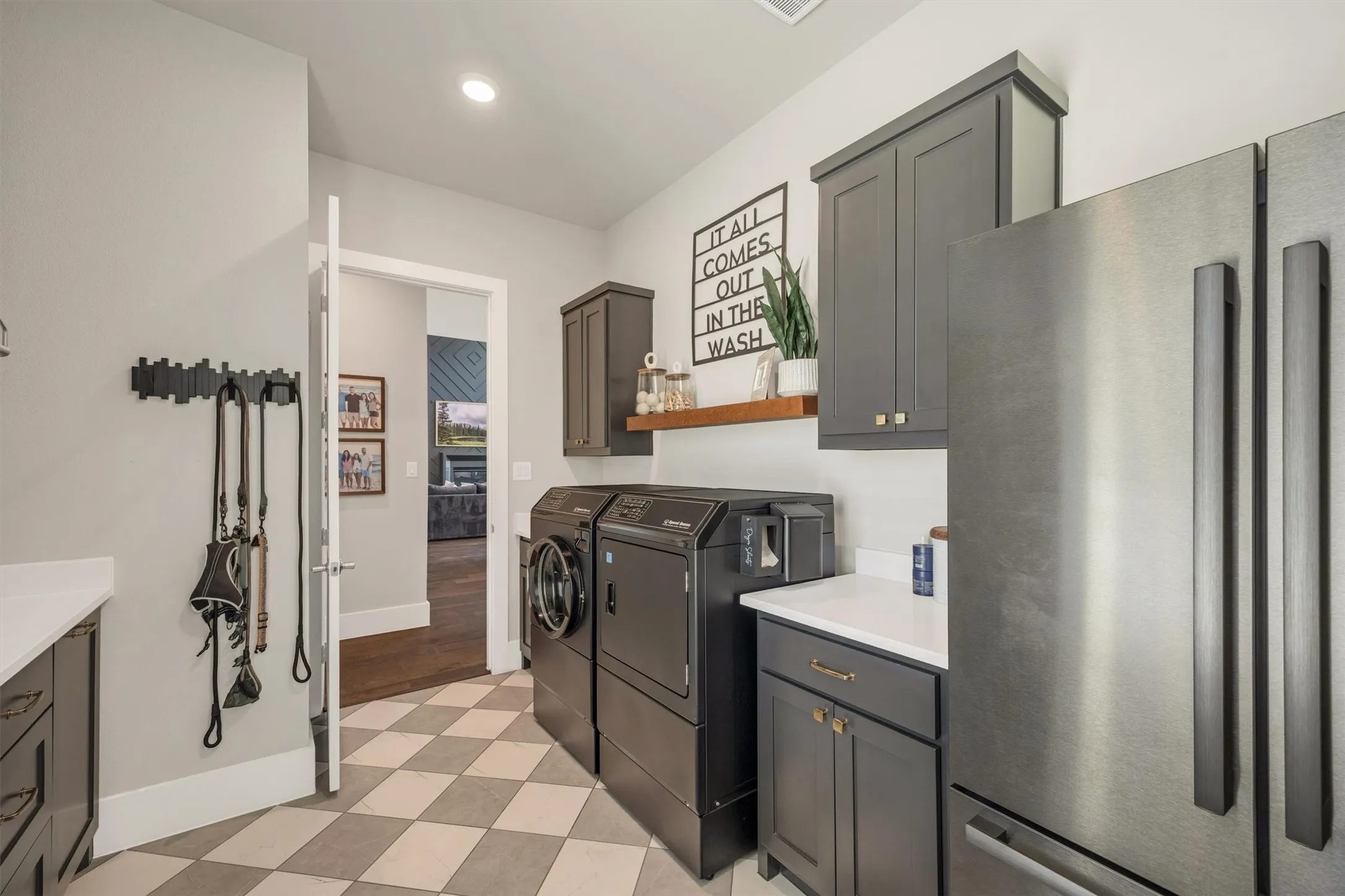 Expansive laundry room with convenient access to the 2nd primary suite