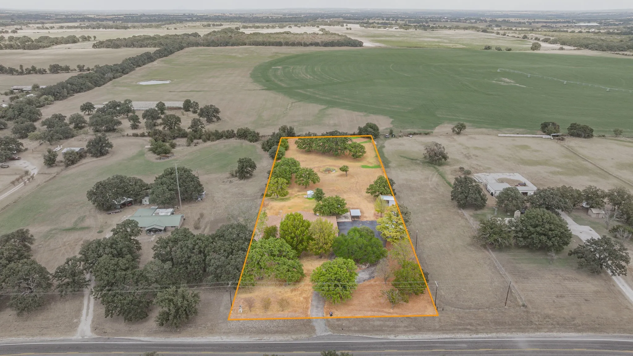 Expansive rural property featuring a perimeter boundary, mature trees, and substantial acreage