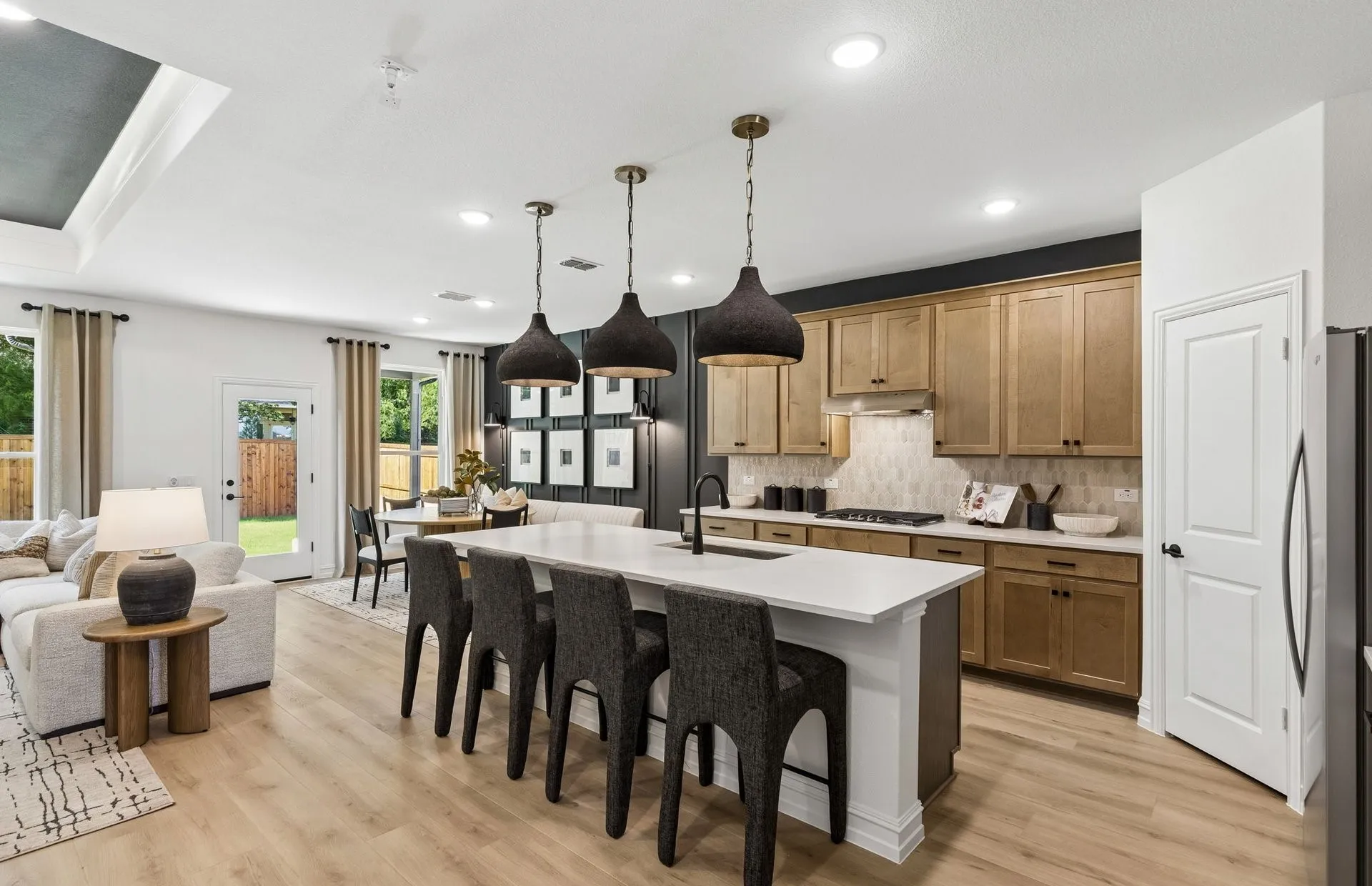 *Model Representation - Large island overlooking gathering room and dining areas