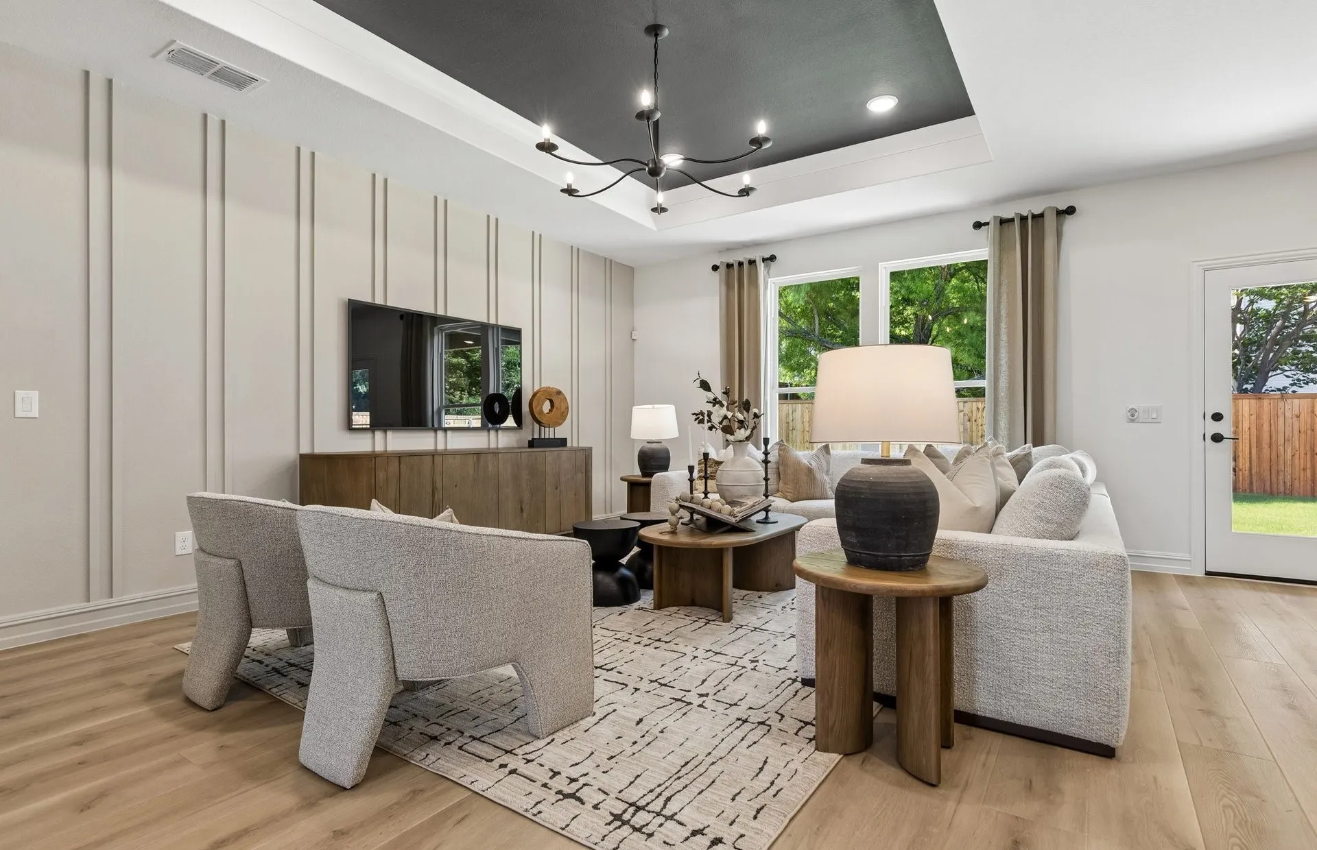 *Model Representation - Spacious gathering room with large windows