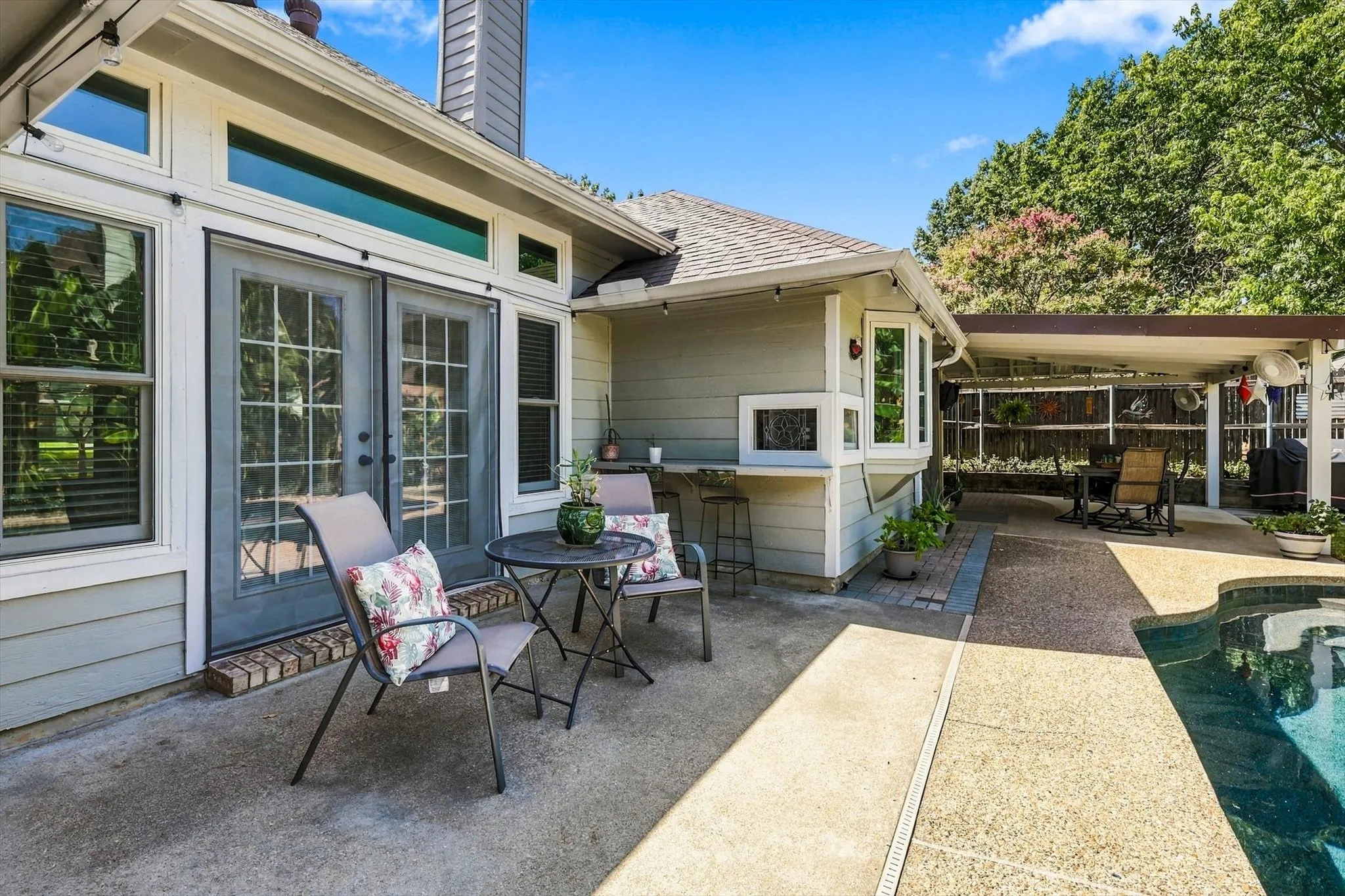 Exterior patio with concrete and exposed aggregate paving