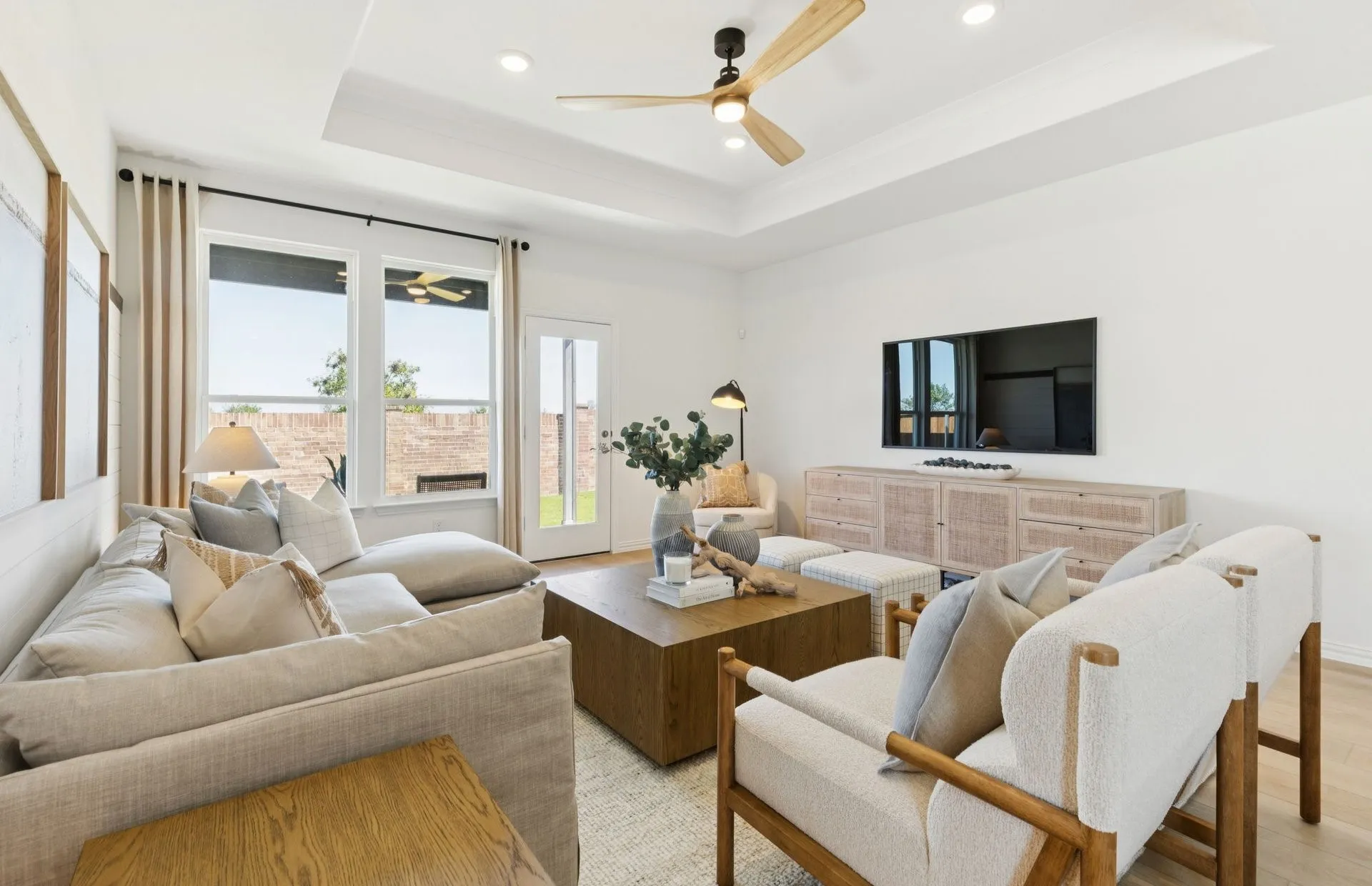*Model Representation - Spacious gathering room with large windows