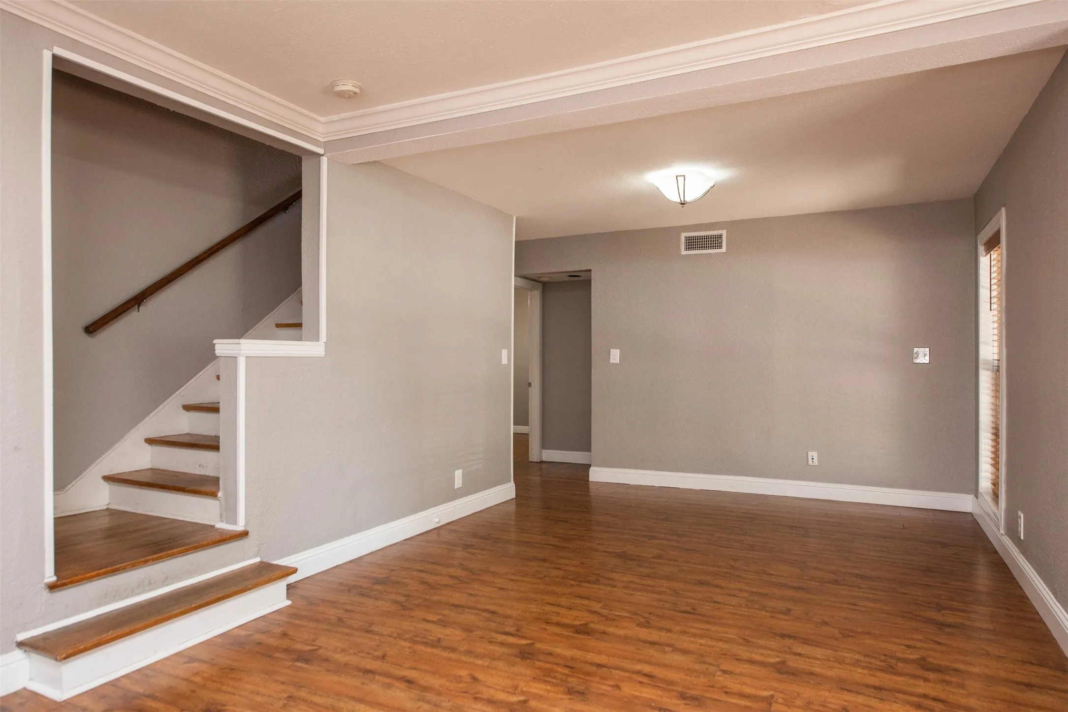 Empty room featuring hardwood / wood-style flooring