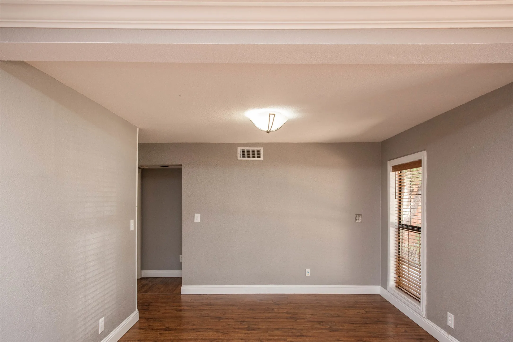 Empty room with wood-type flooring