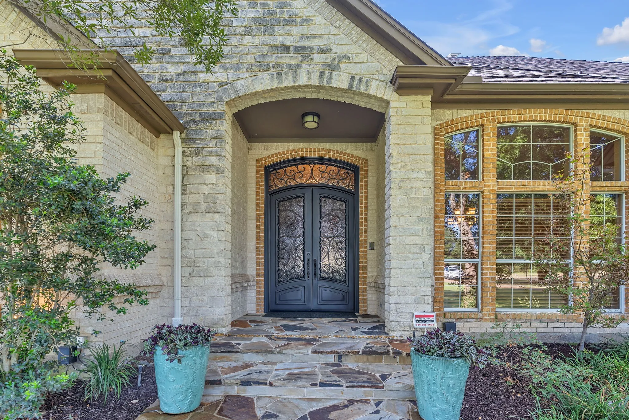 Beautiful iron doors provide a stately entry