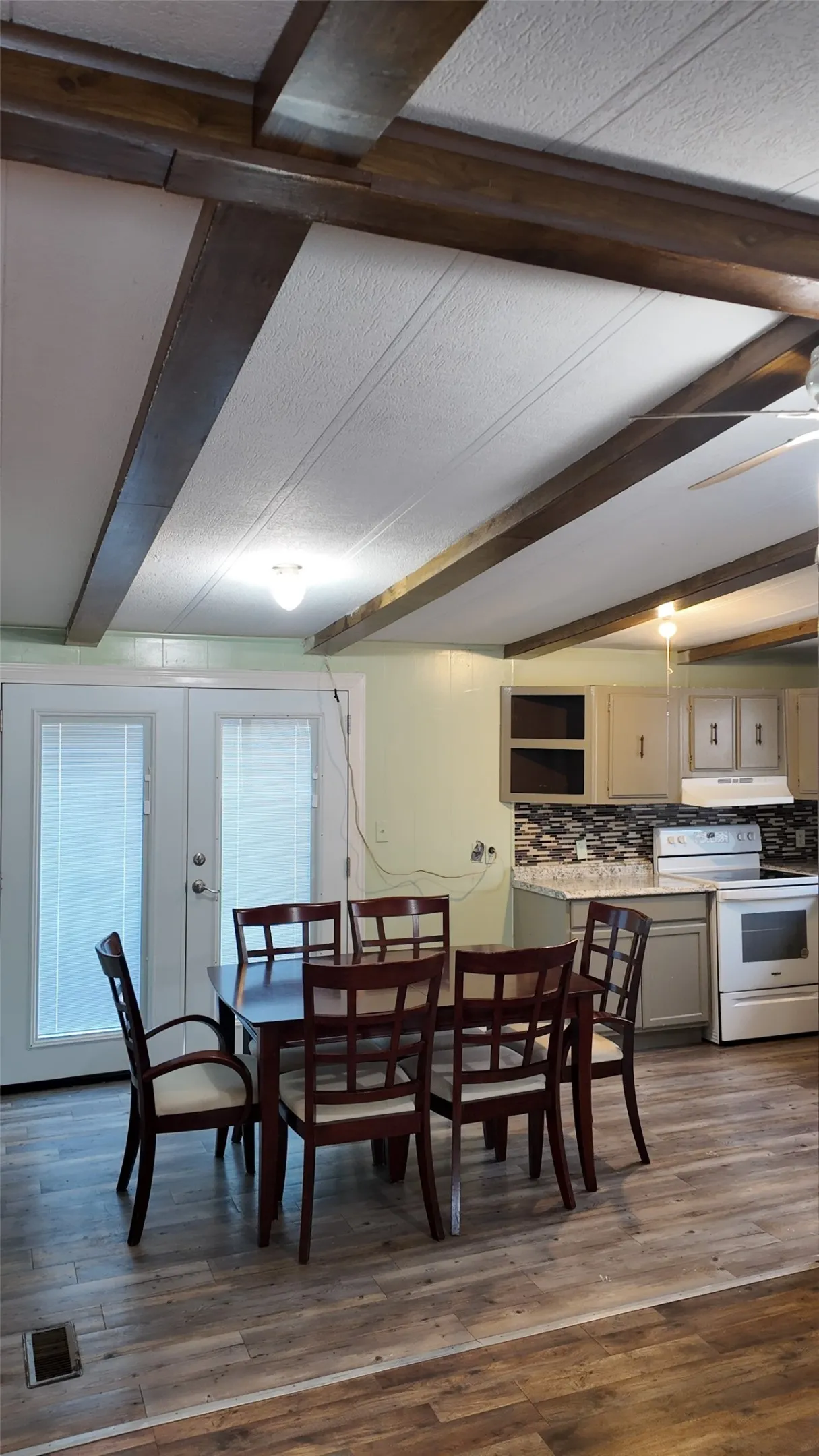 Wood-finish flooring throughout the dining area