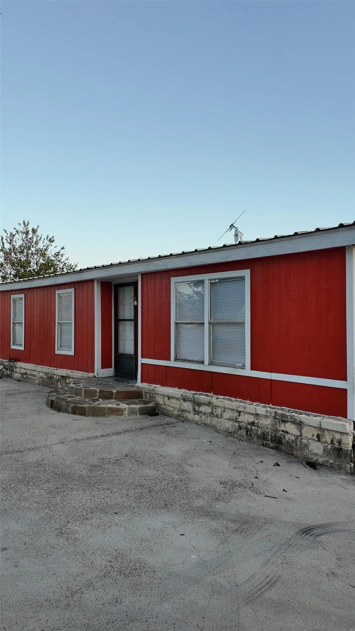 Red horizontal siding with white trim