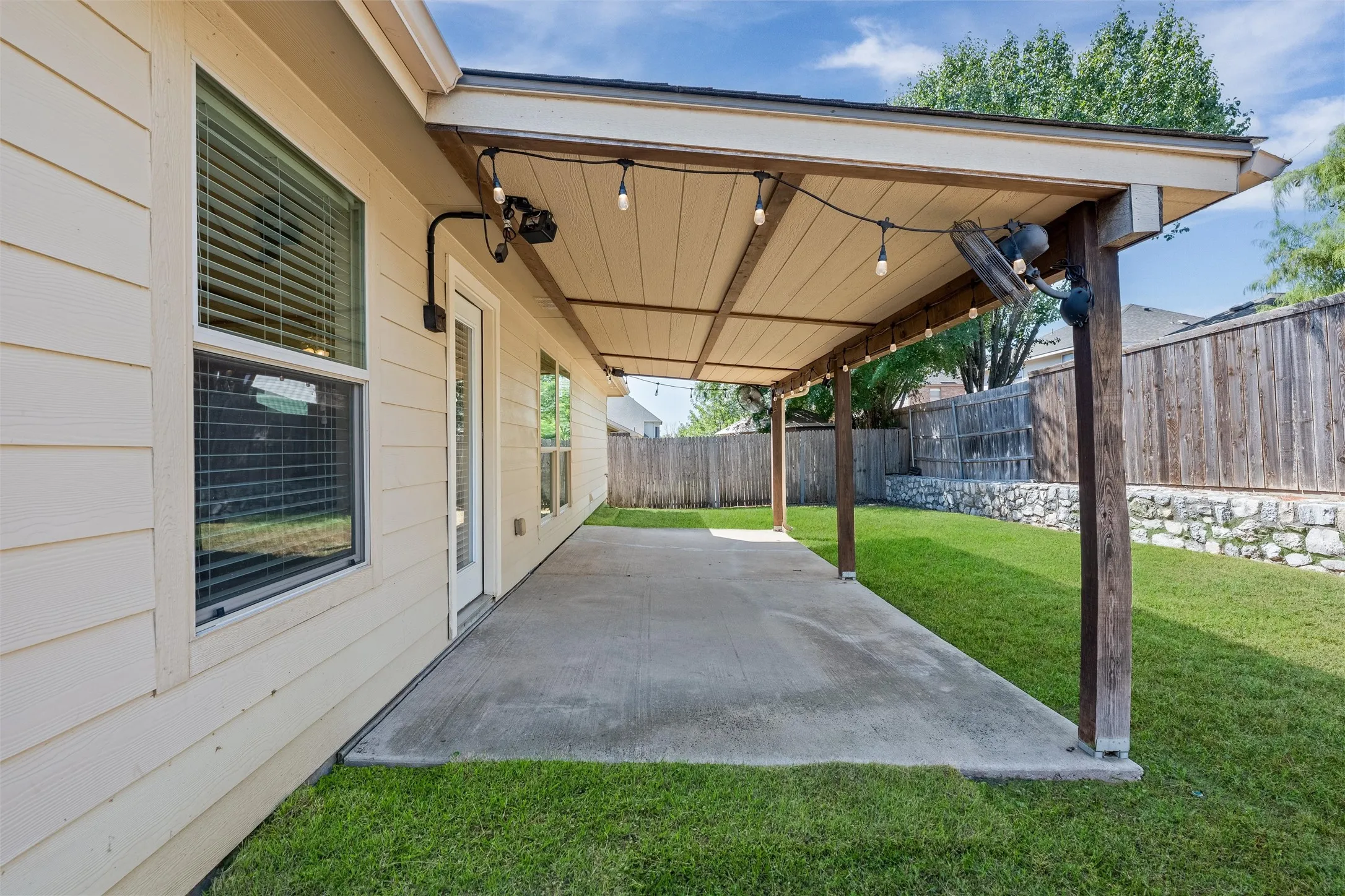 Covered patio with fan.