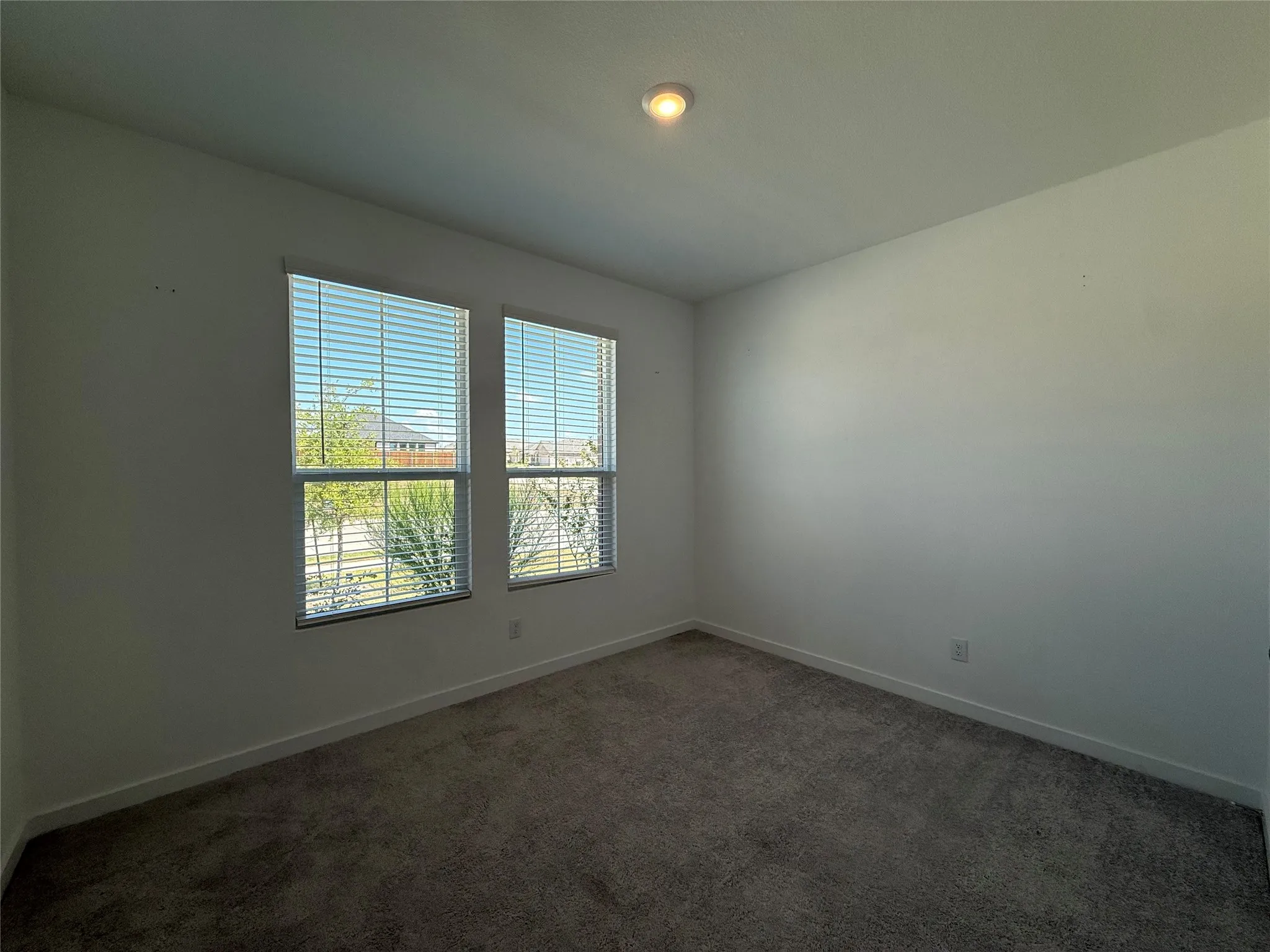Two windows with integrated blinds