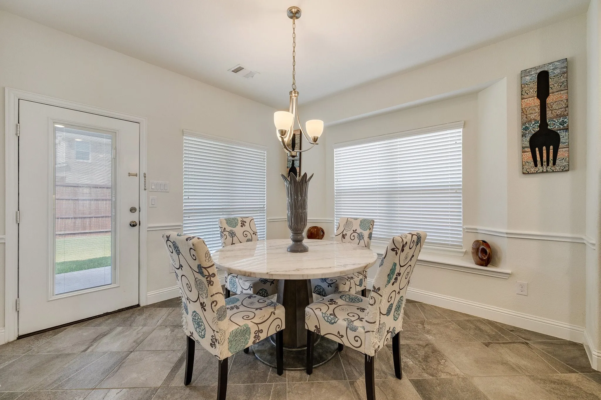 Breakfast Area: A bright breakfast area surrounded by windows makes a wonderful spot for morning coffee and casual meals.