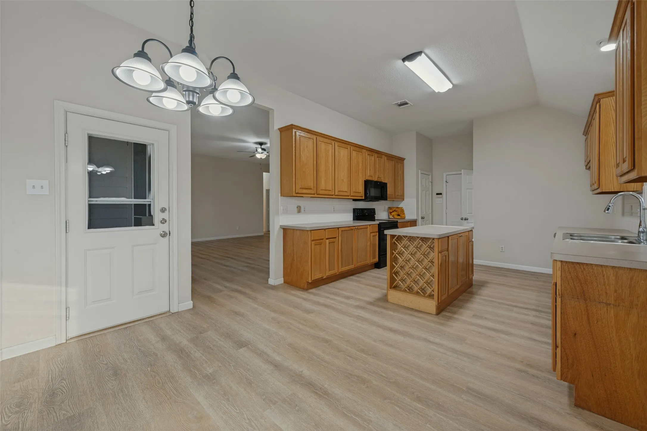 Kitchen with entrance to the backyard.
