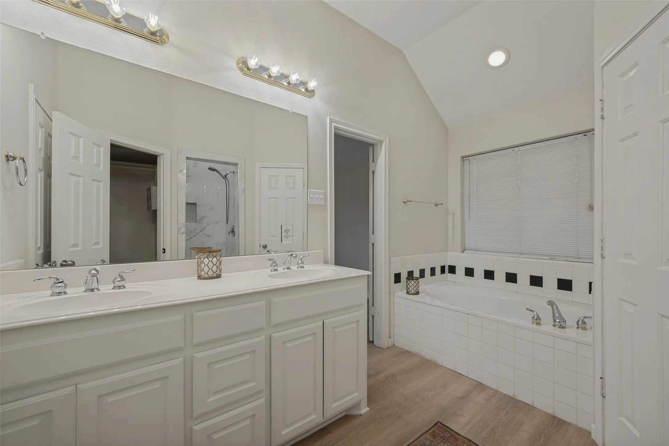 Primary bath with garden tub, double sinks and dual closets