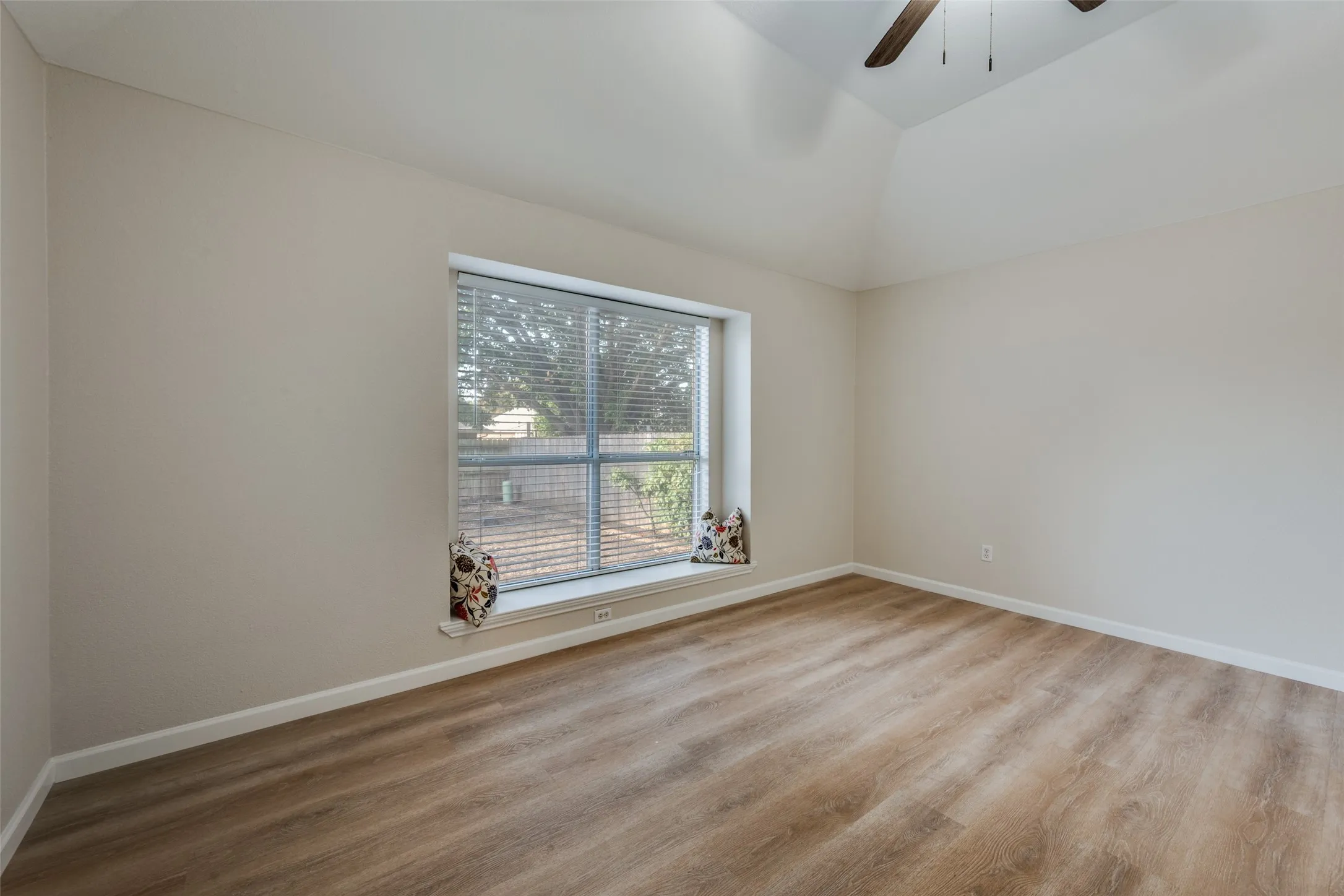Primary bedroom with window seat.