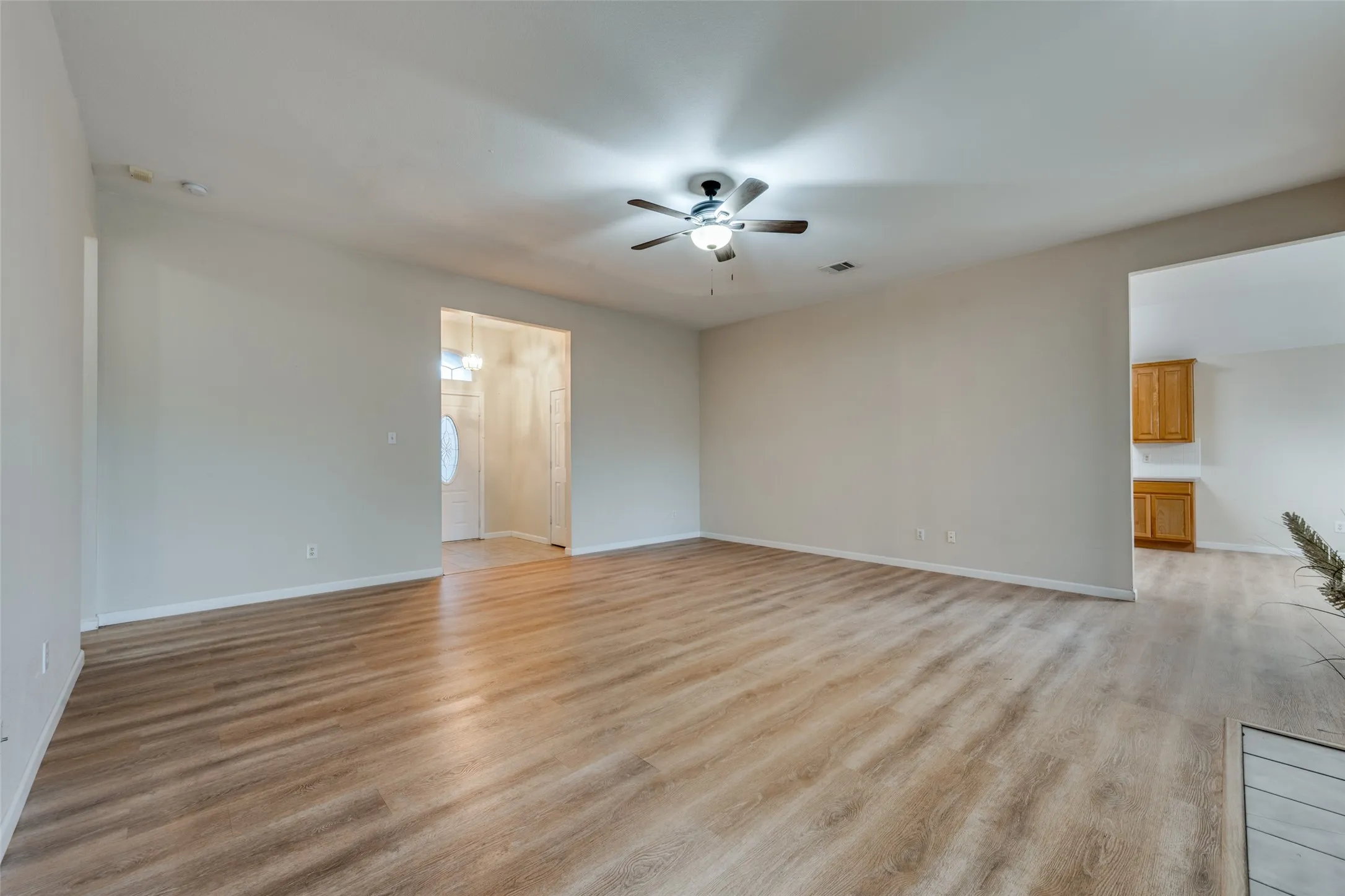 Living room with front entryway.
