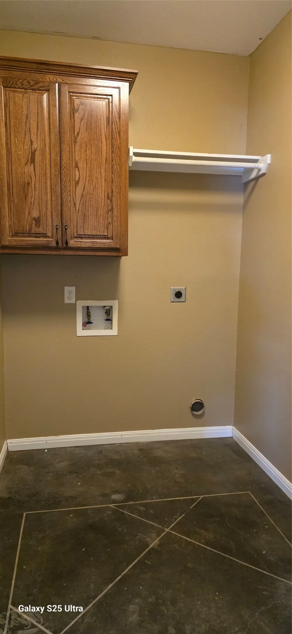 Oak-finish cabinetry with crown molding