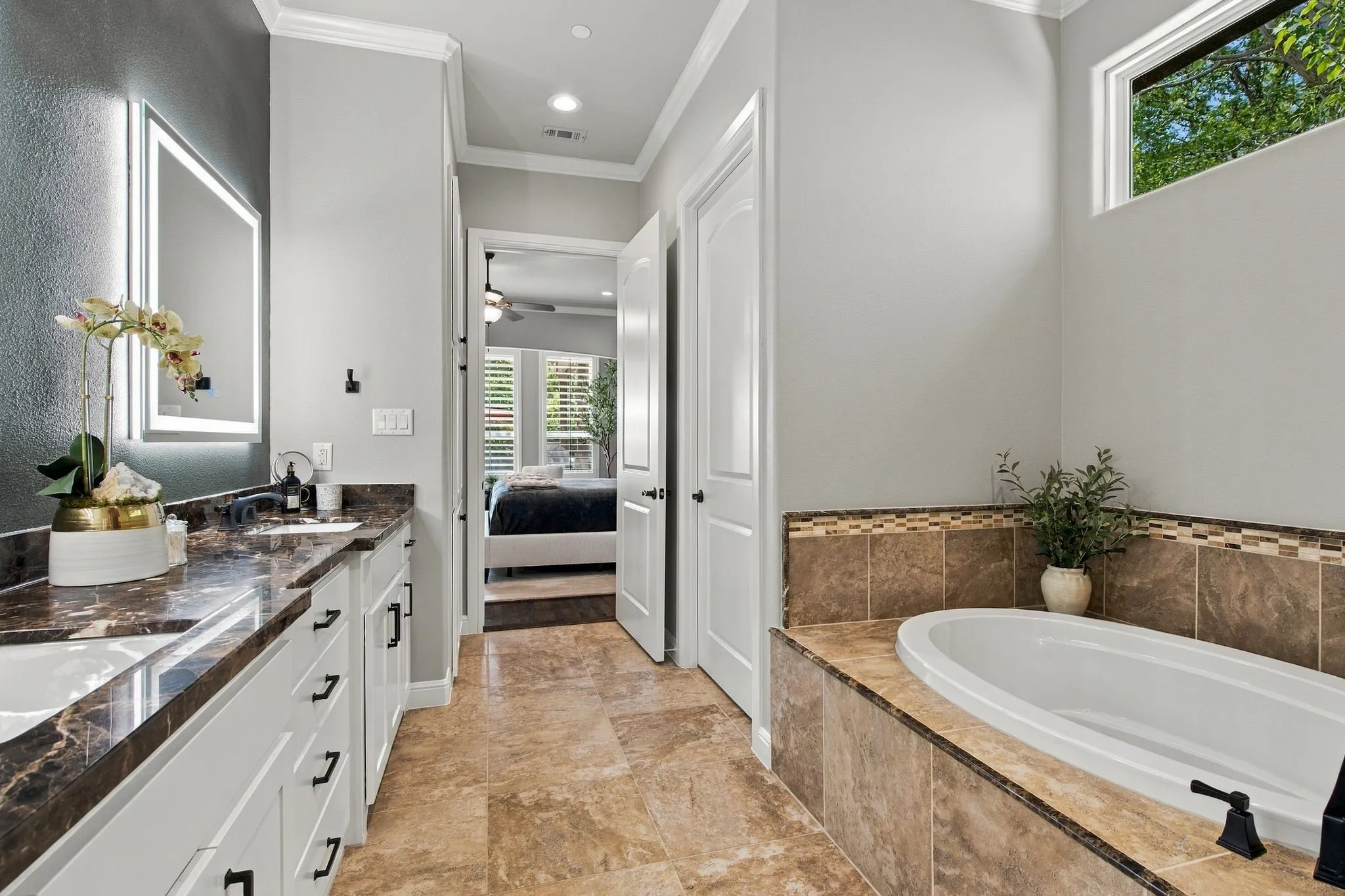 Dual vanity with integrated sinks and dark stone countertops
