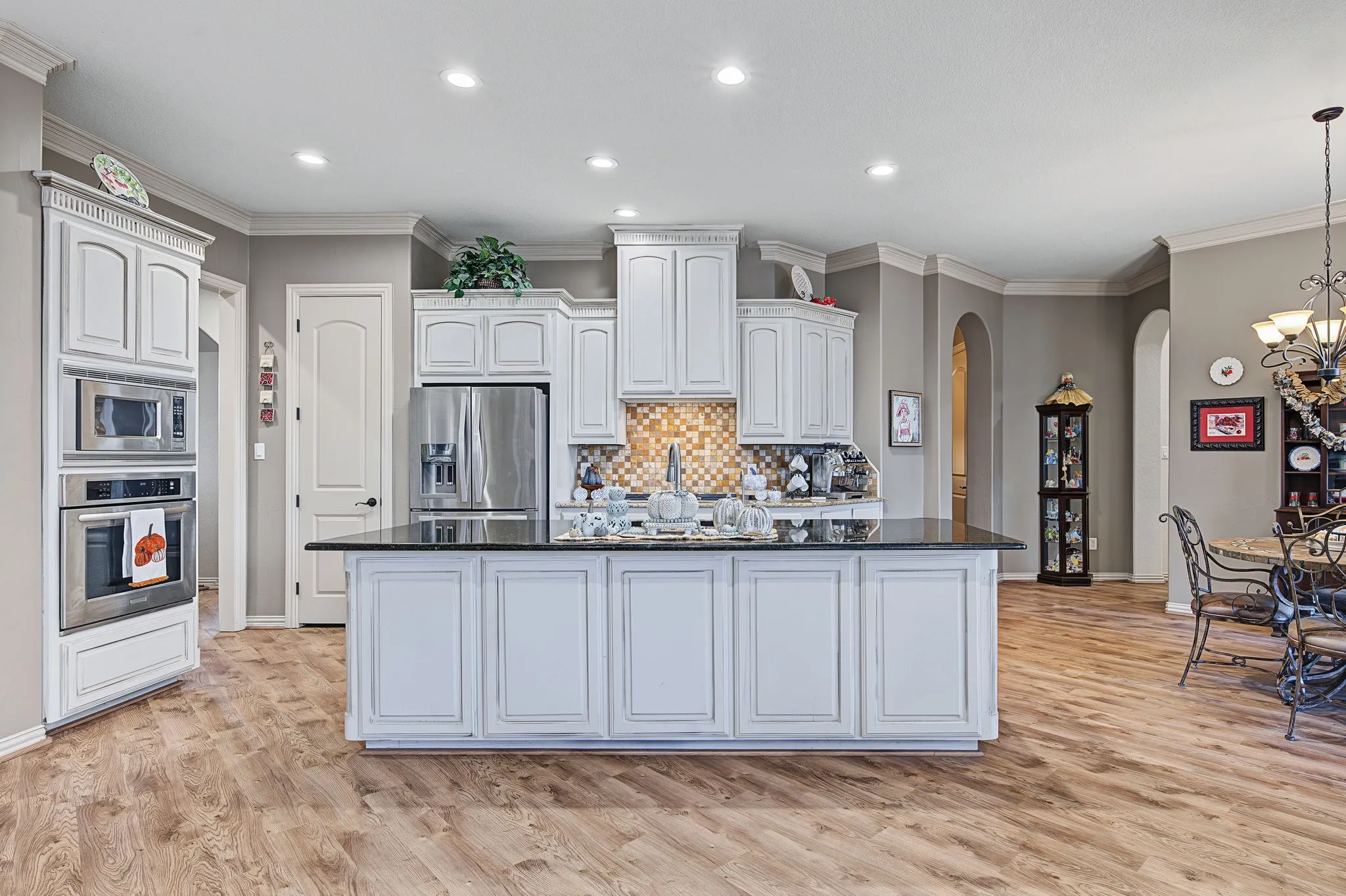 Well-appointed kitchen offers generous cabinetry, ample counter space, and an open connection to the main living and dining areas.