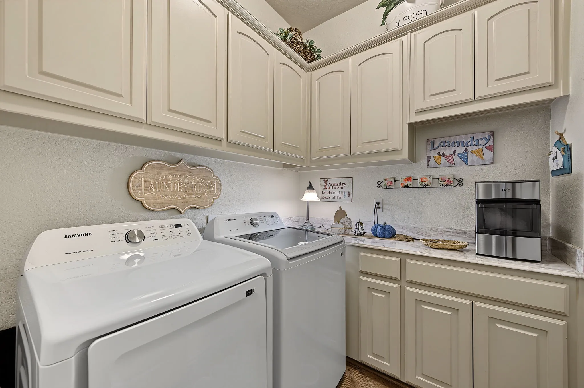 Built-in cabinetry with panel doors, countertop workspace, and overhead recessed lighting