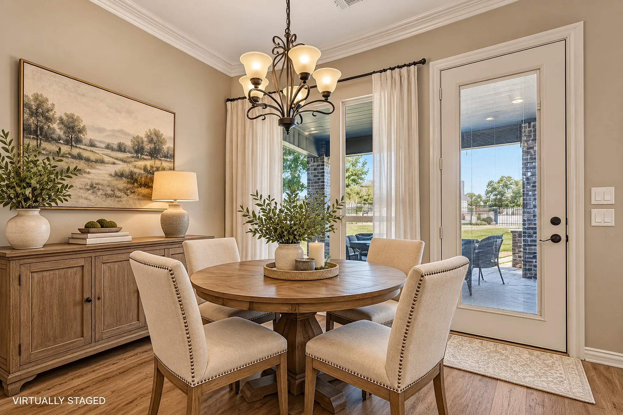 Virtually staged with modern transitional  furniture. Wood-finish flooring, crown molding, and a chandelier with glass shades