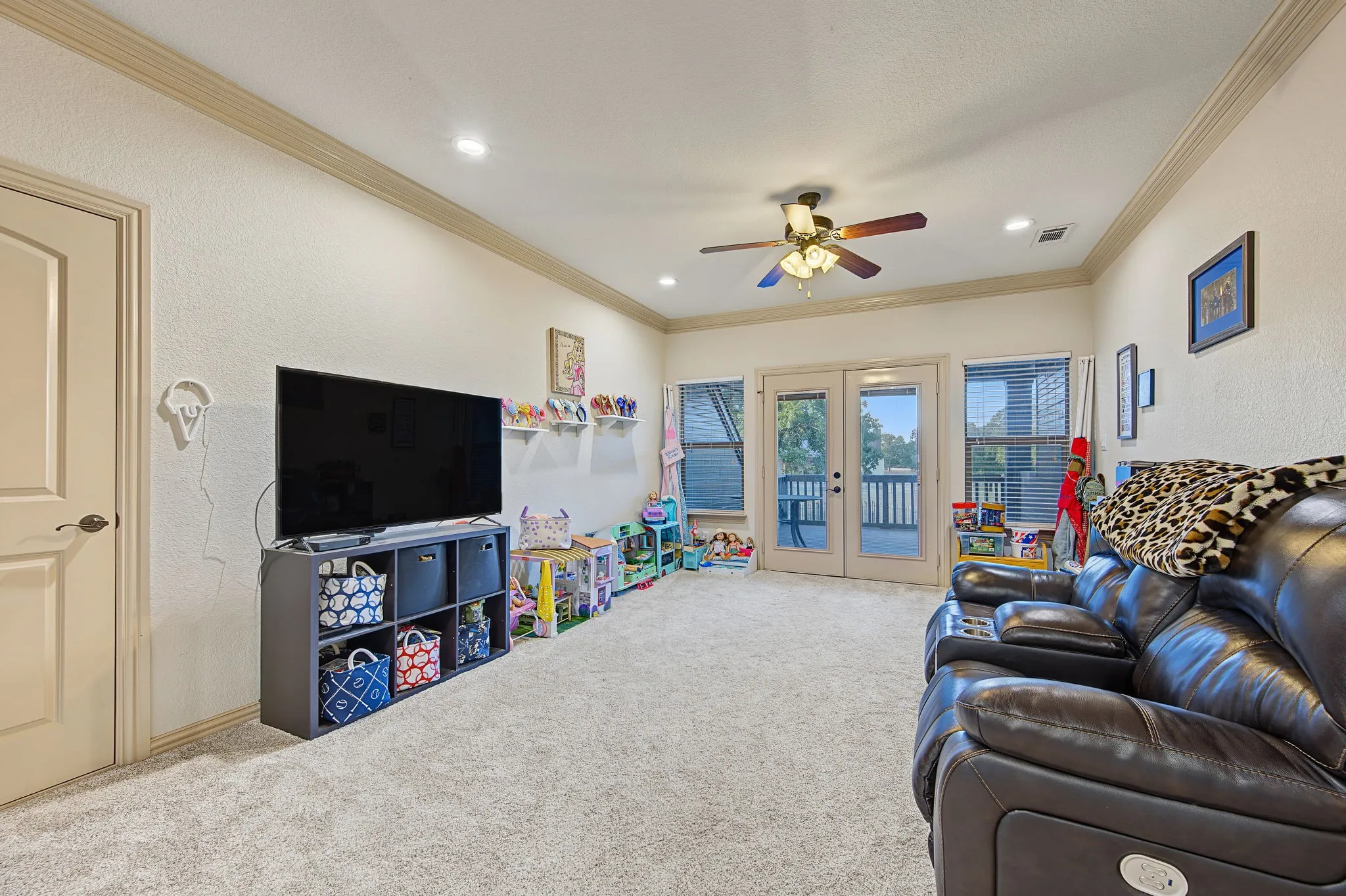 Located at the top of the stairs is a perfect hang out room with access to the second story patio,