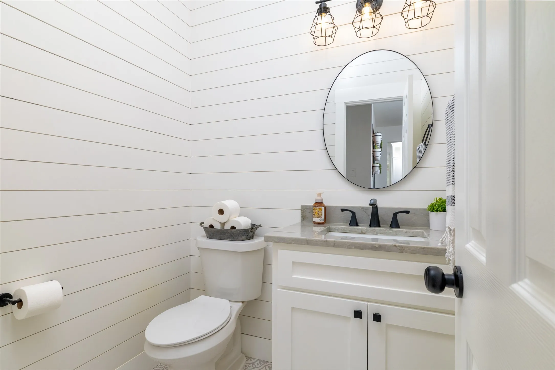 Half bathroom located off side of Living Room