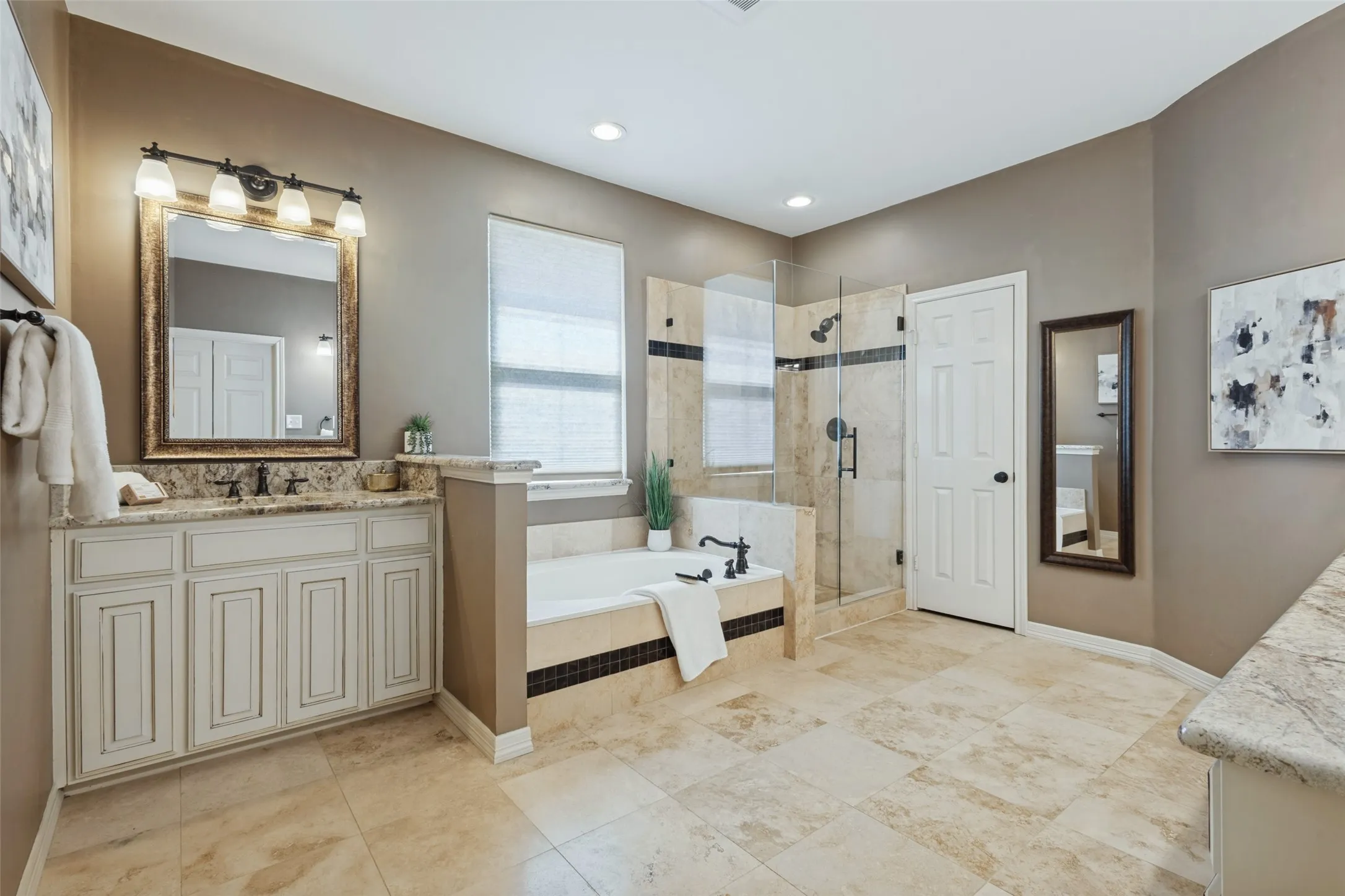 The primary bath is spacious and updated.