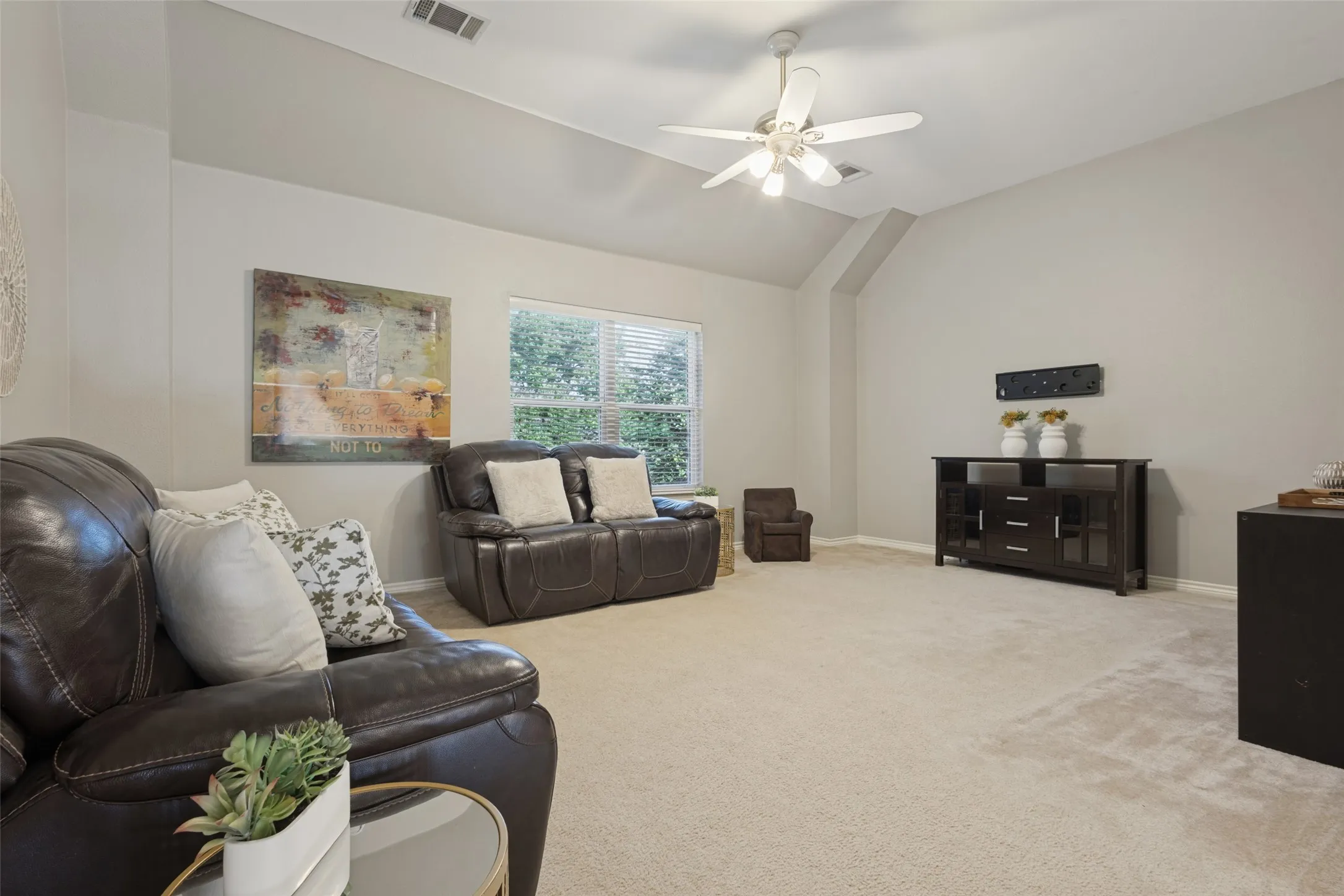 The game room is so spacious that it can accommodate a pool table.