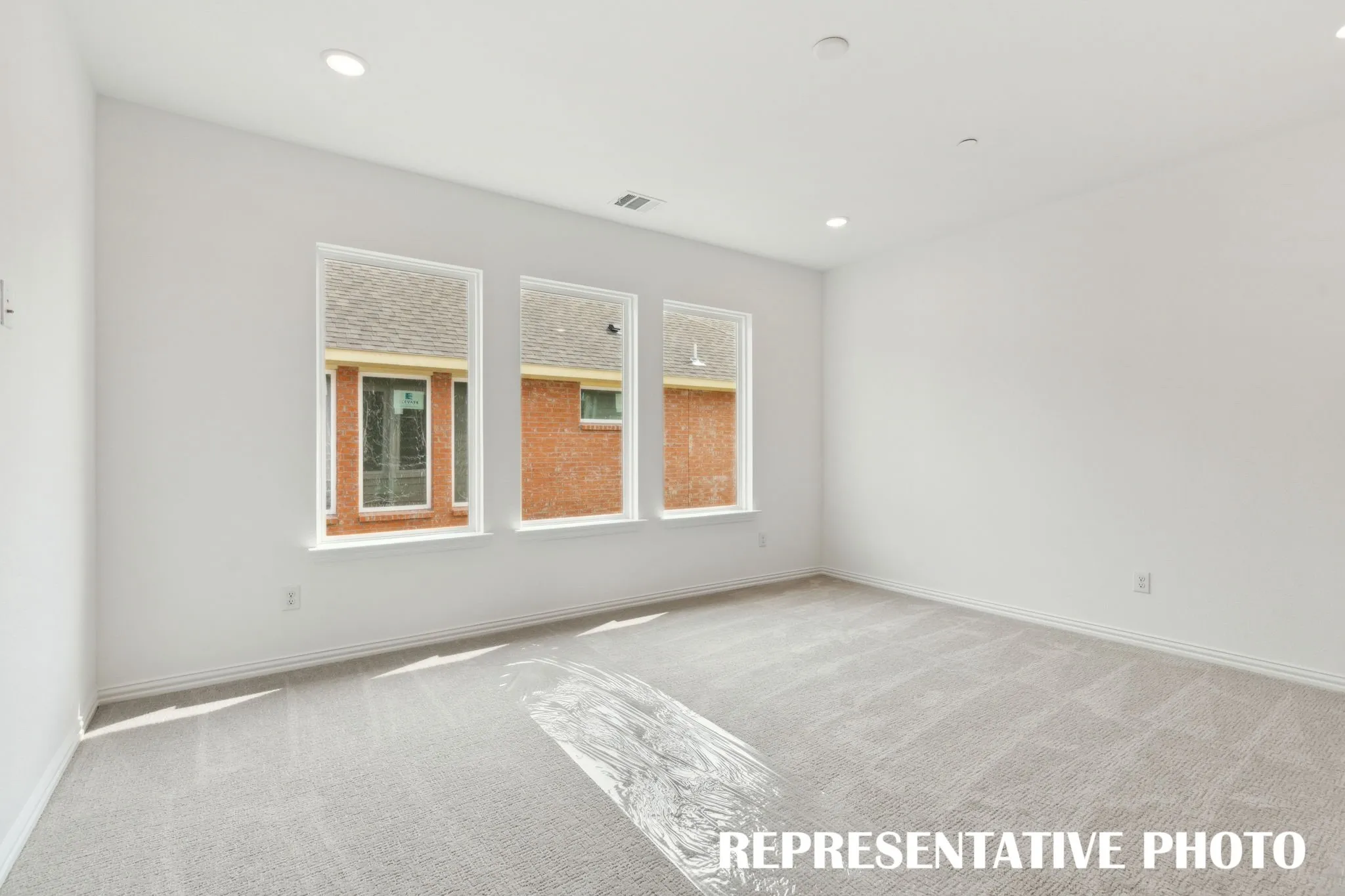 The family fun time continues upstairs in this light filled game room!  REPRESENTATIVE PHOTO