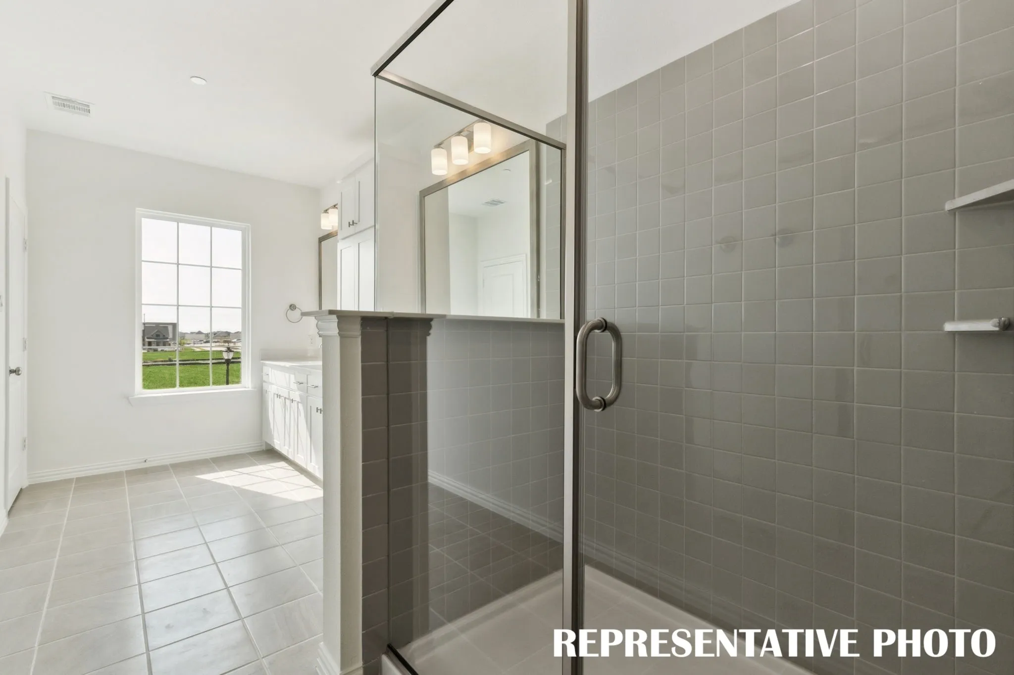 You'll find a spacious step in shower in this dream owner's bath!  REPRESENTATIVE PHOTO