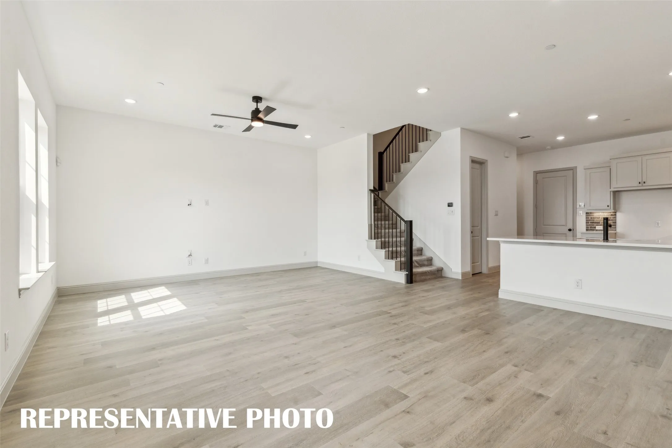 This beautiful light, bright and airy family room is the perfect place to entertain family and friends.  REPRESENTATIVE PHOTO