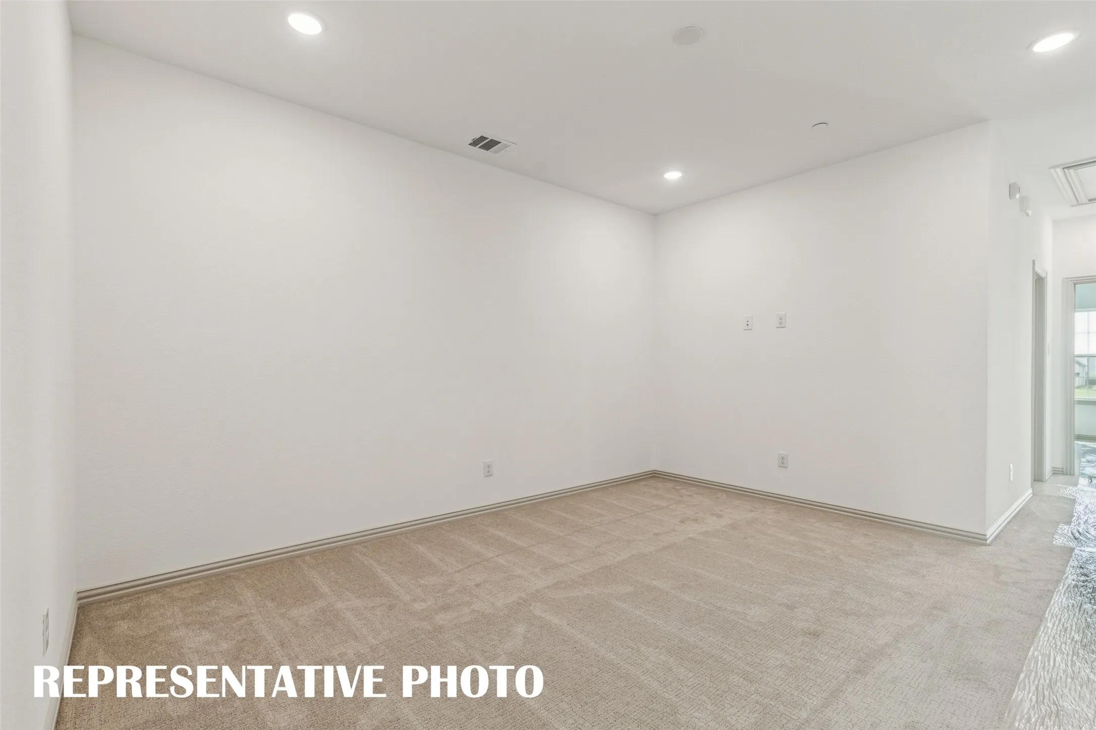 The upstairs game room offers an additional family living space or would make a perfect home office!  REPRESENTATIVE PHOTO