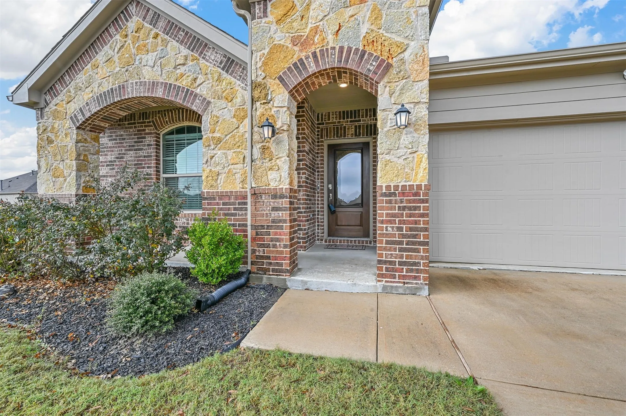 Entrance to property with a garage
