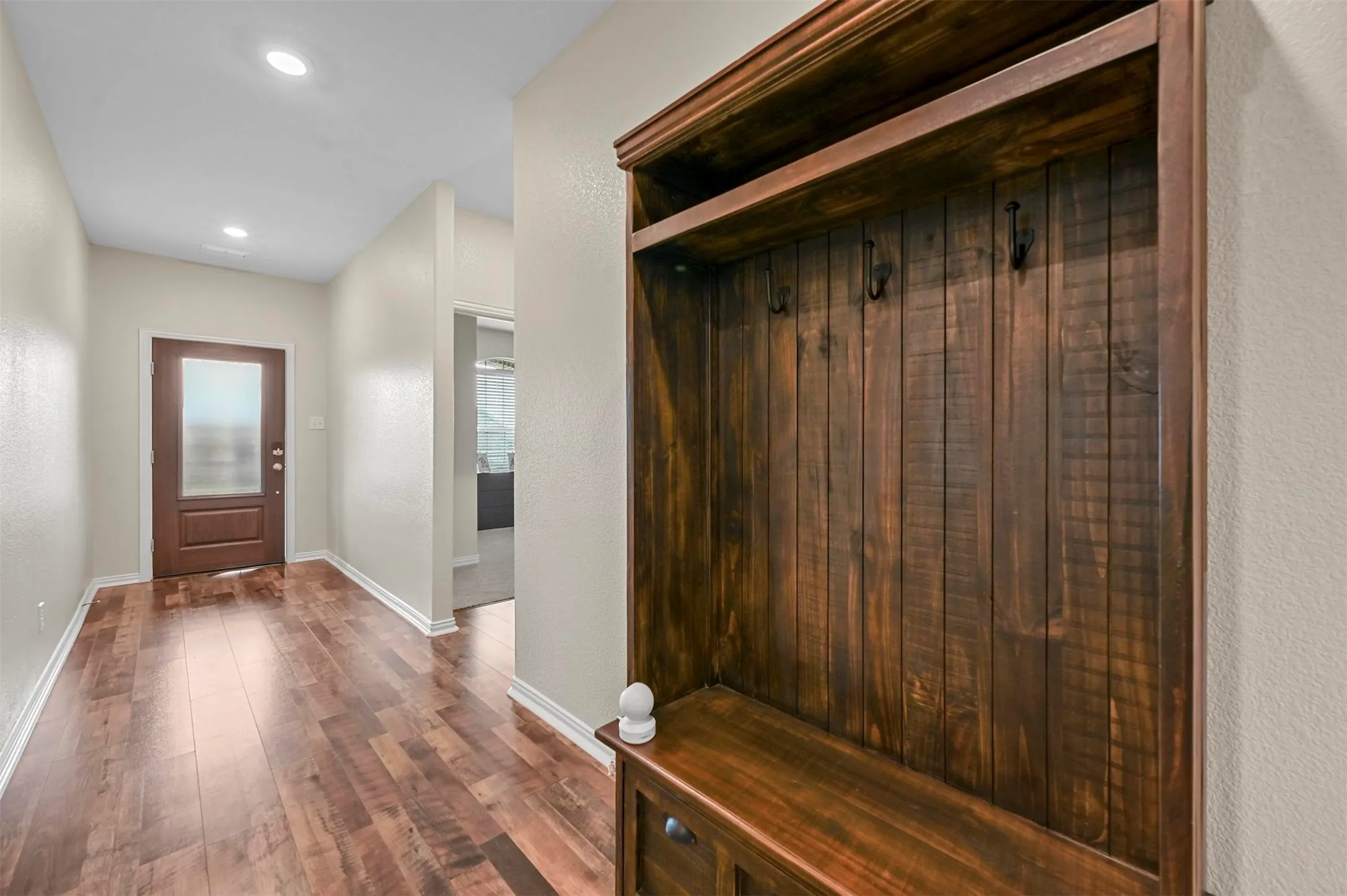 Mudroom with dark hardwood / wood-style floors